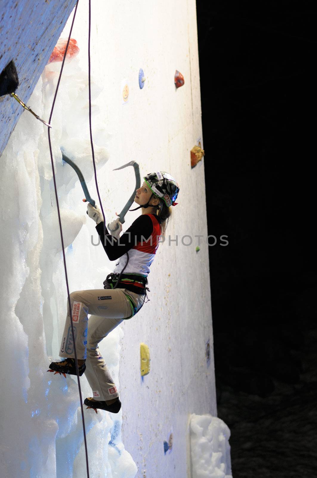 UNKEN, AUSTRIA - FEB 19: Ice climbing european cup finals. Lucie Hrozoca on her final run to win the competition on February 19, 2011 in Heutal, Unken in Austria.
