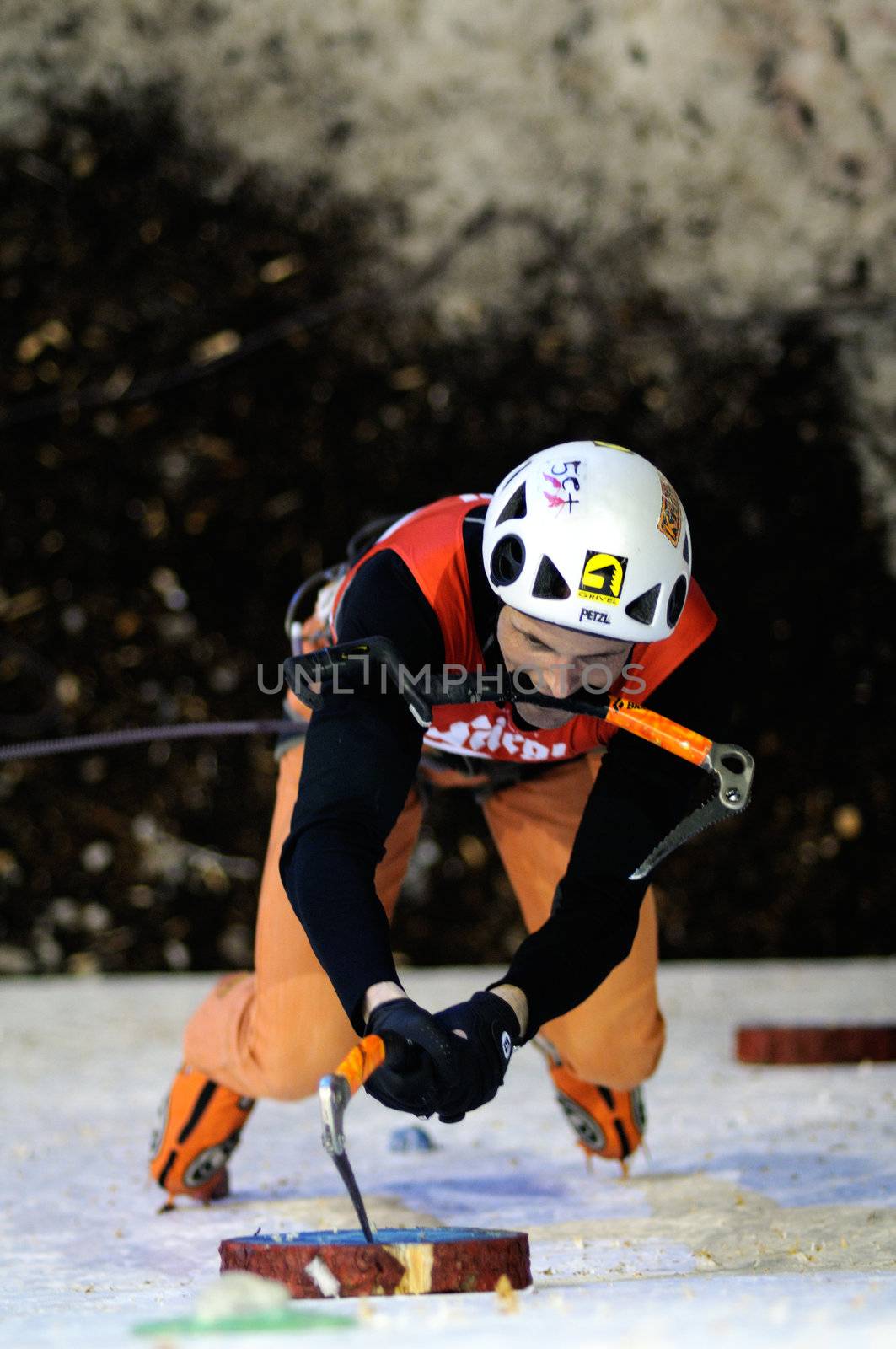 UNKEN, AUSTRIA - FEB 19: Ice climbing european cup finals. Benedikt Purner climbing at the night finals on February 19, 2011 in Heutal, Unken in Austria.