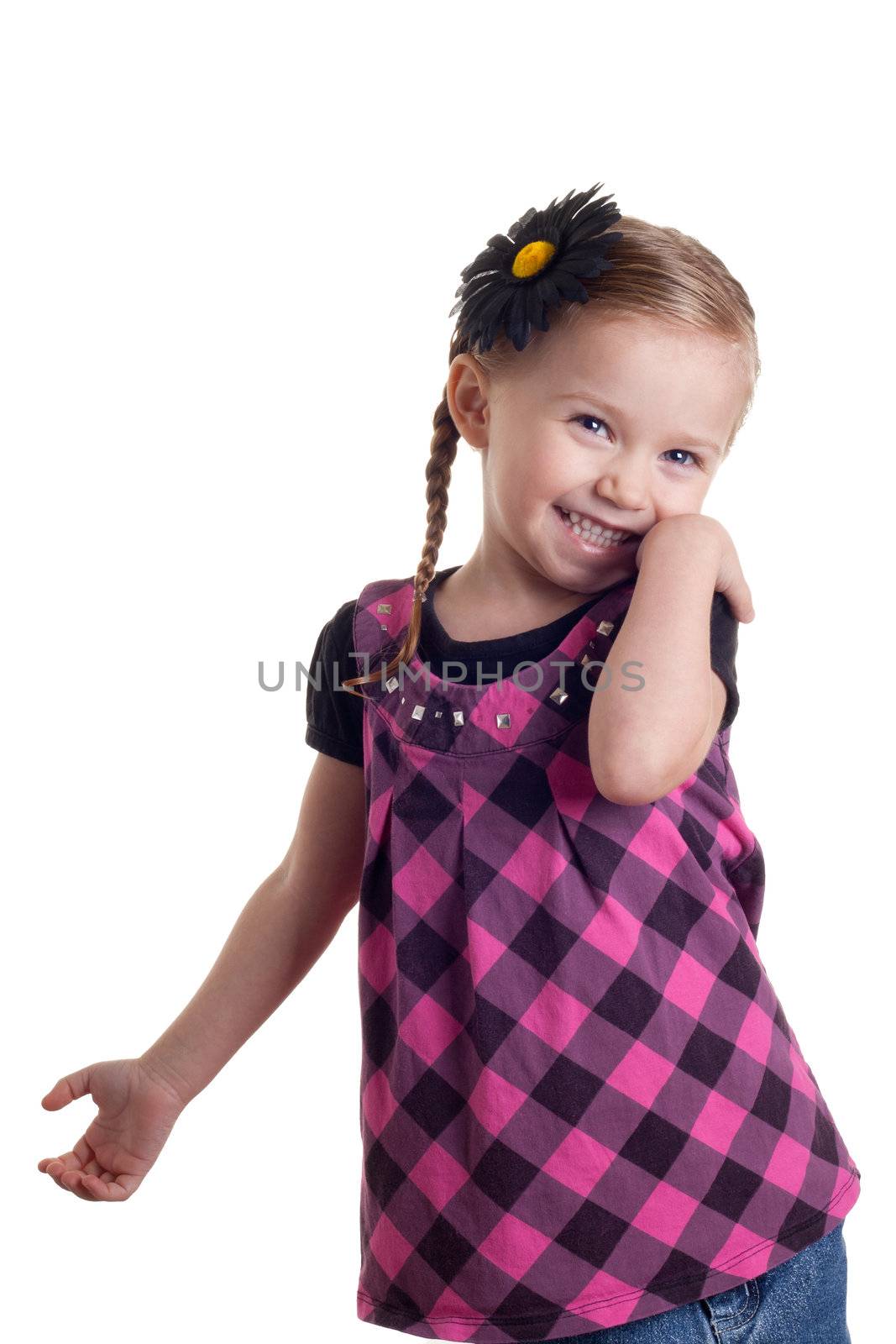 A happy and shy girl standing with a smile on her face.  The image is isolated on white.