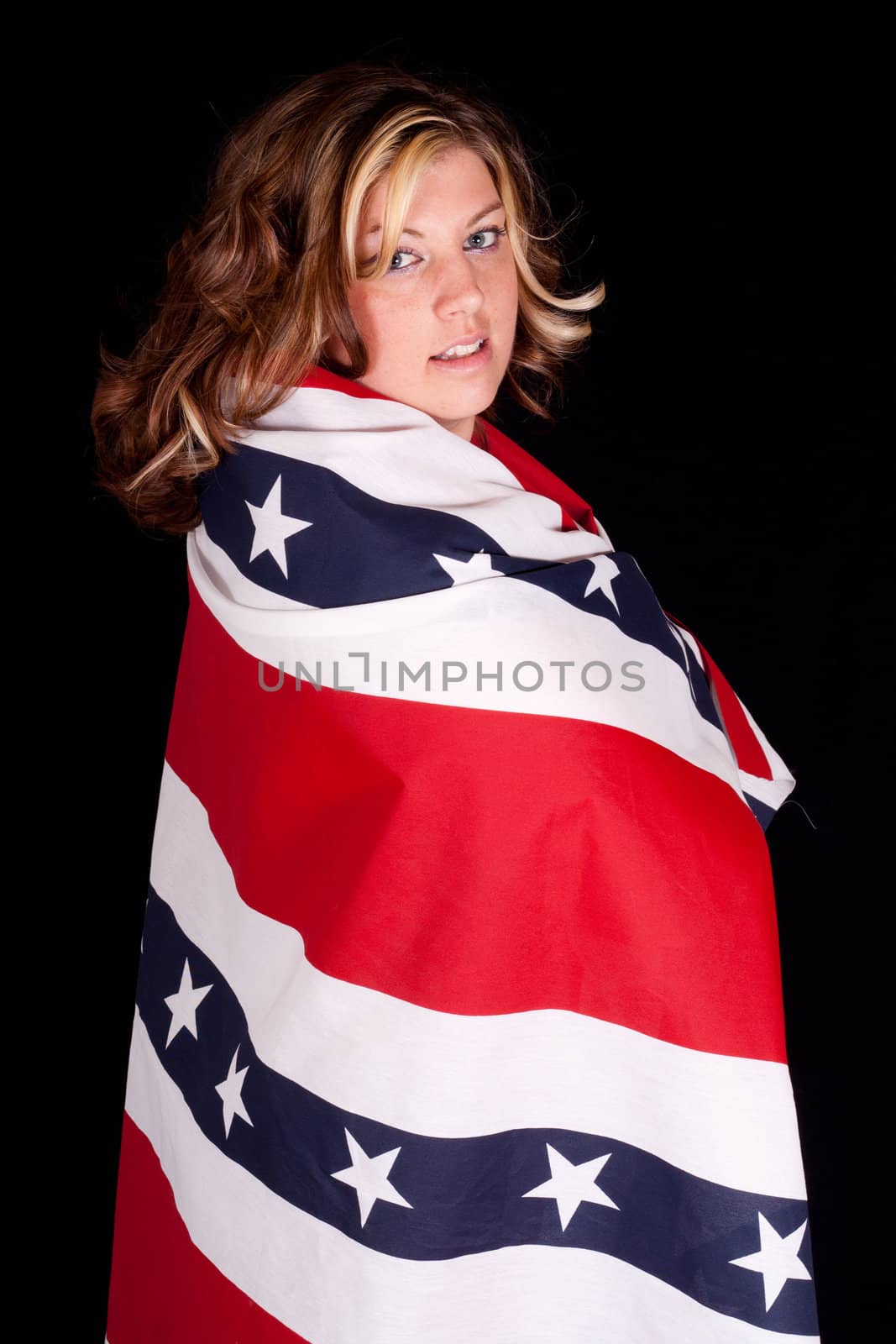 A fourth of july photograph of a cute young women.