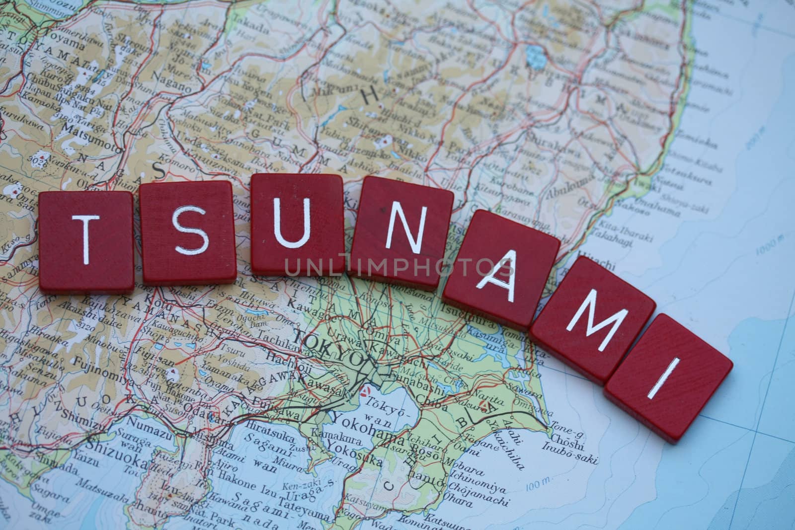 Map of Tokyo, Japan, with word Tsunami in red blocks