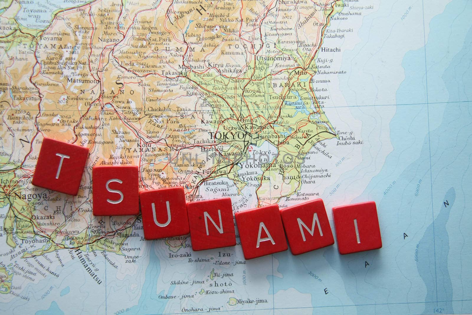 Tsunami in Japan, map of Japan with Tsunami spelled in red letters