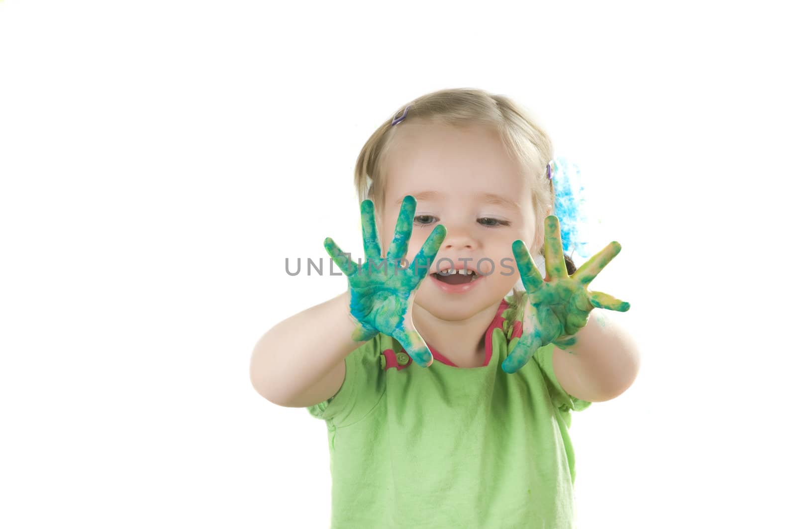 A little girl standing in studio