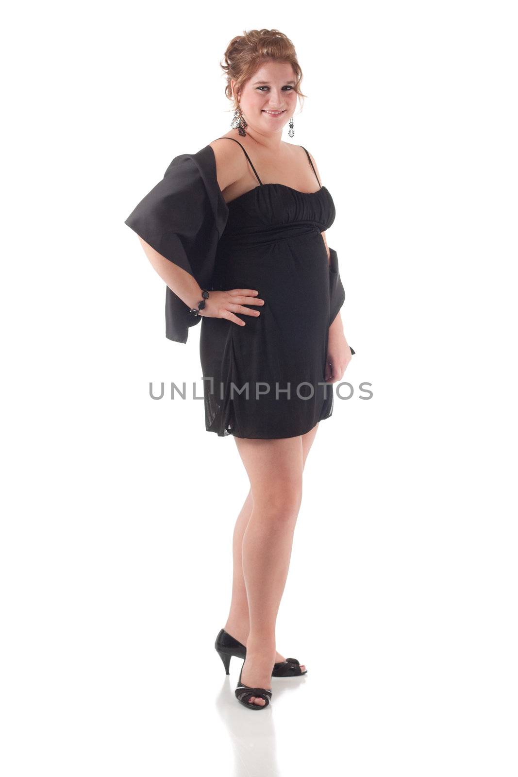 Teenage girl in black formal dress, isolated on white