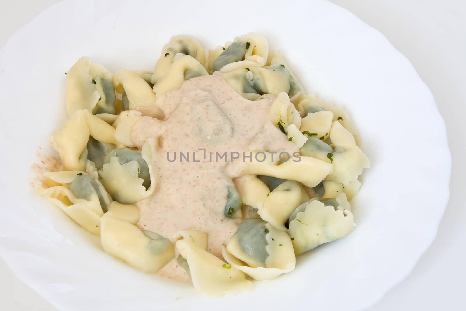 Typical dish of Ligurian cooking: paste stuffed like ravioli with walnut sauce
