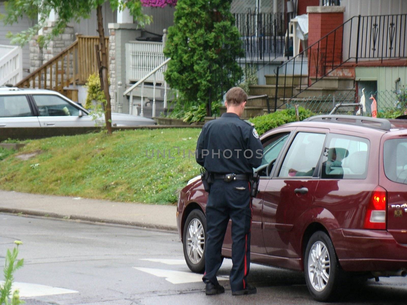 a traffic ploice giving out speeding ticket