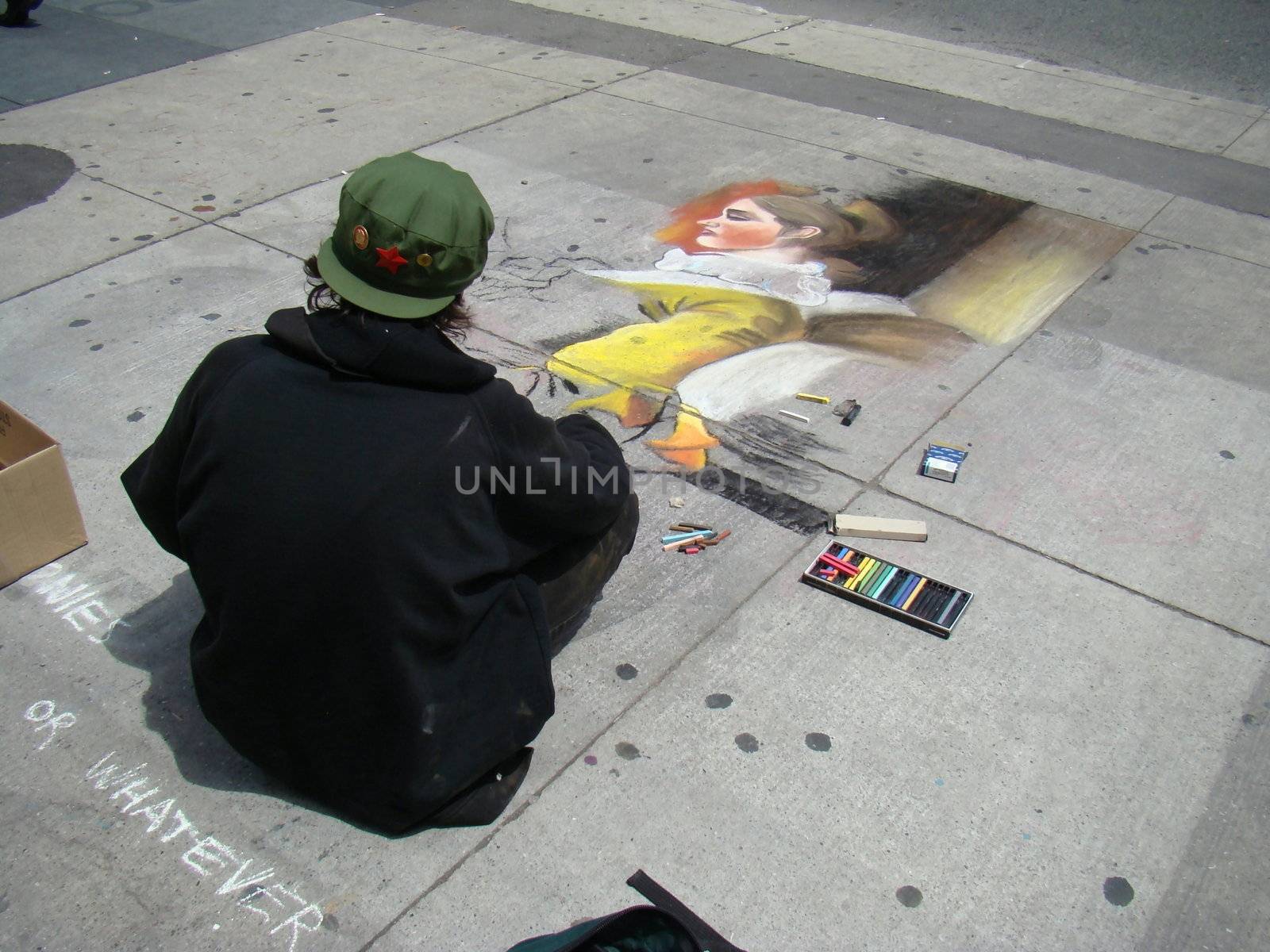 sidewalk chalk artist makes spare change while drawing pictures