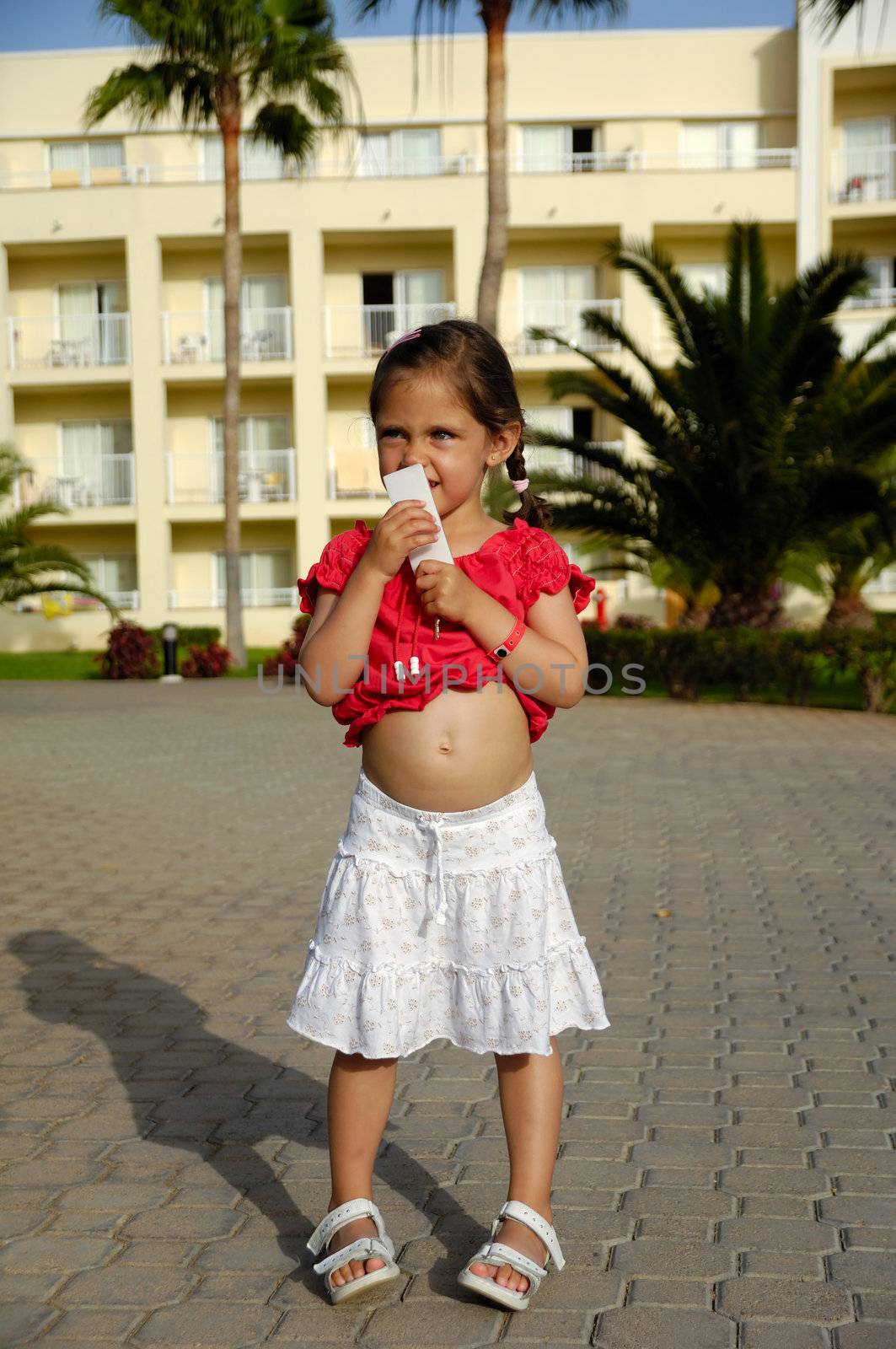 Young child is holding a hotel key