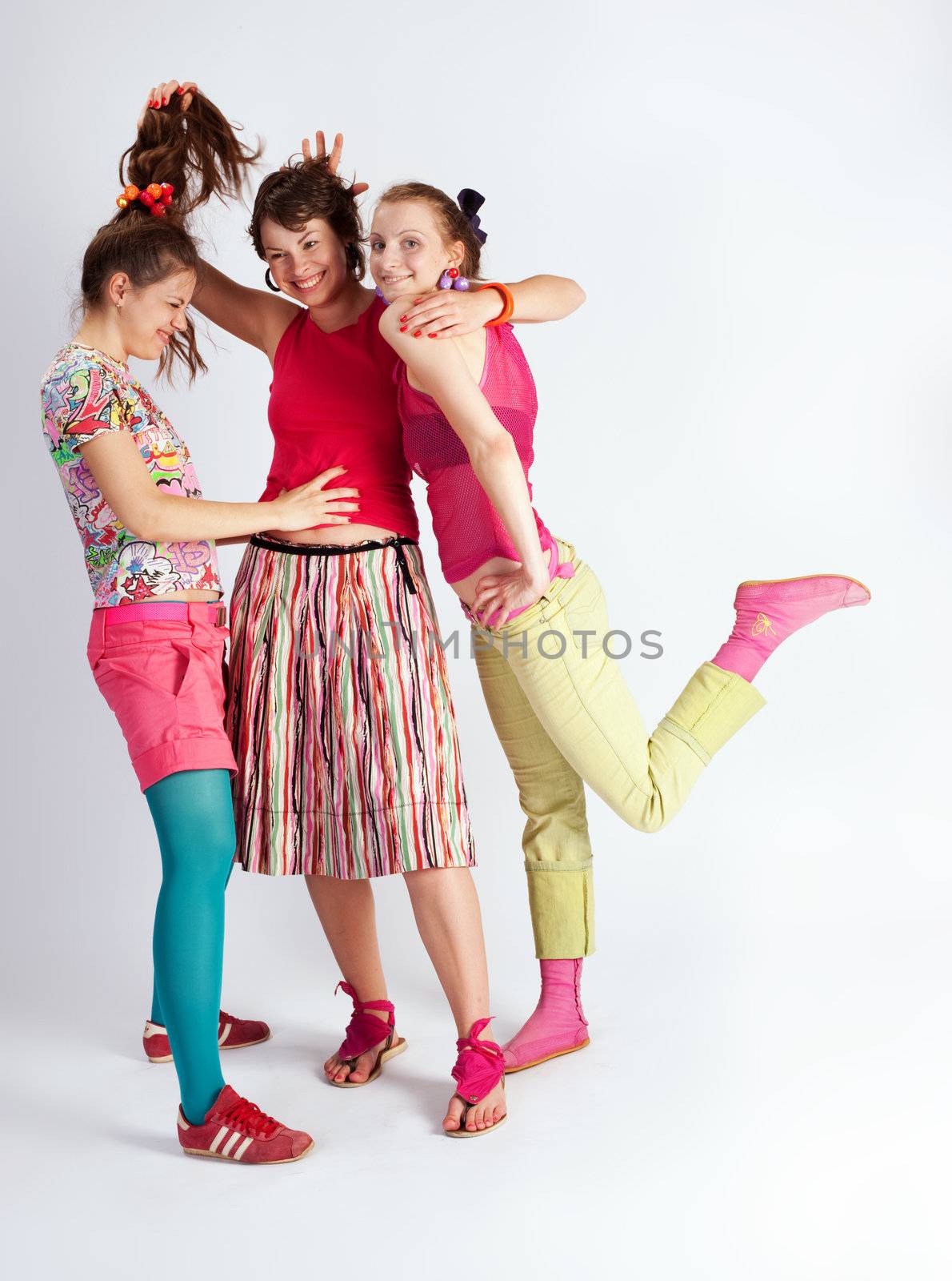 happy young women with a smile in bright multi-coloured clothes