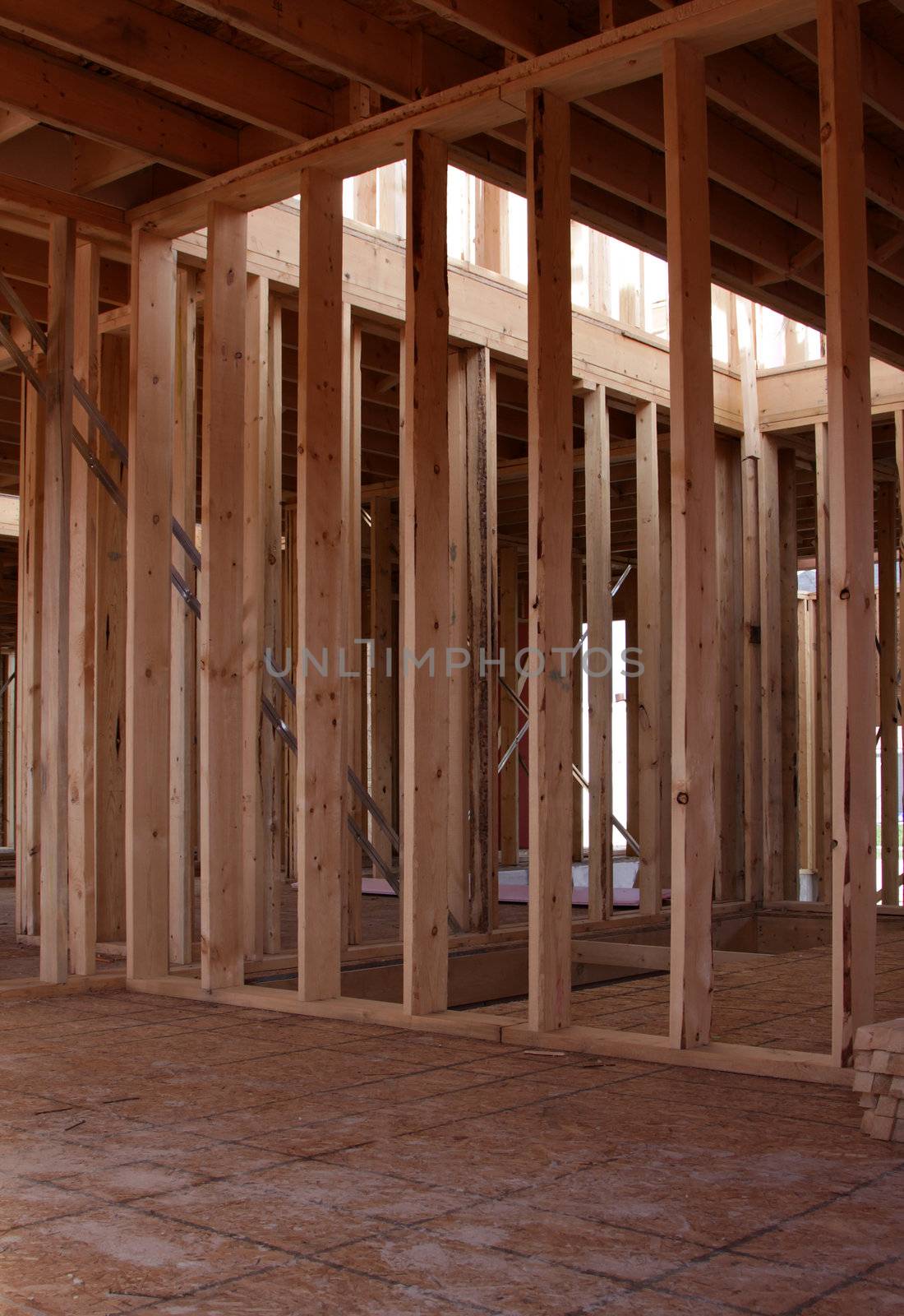 The wood framing of the interior of a new housing project.
