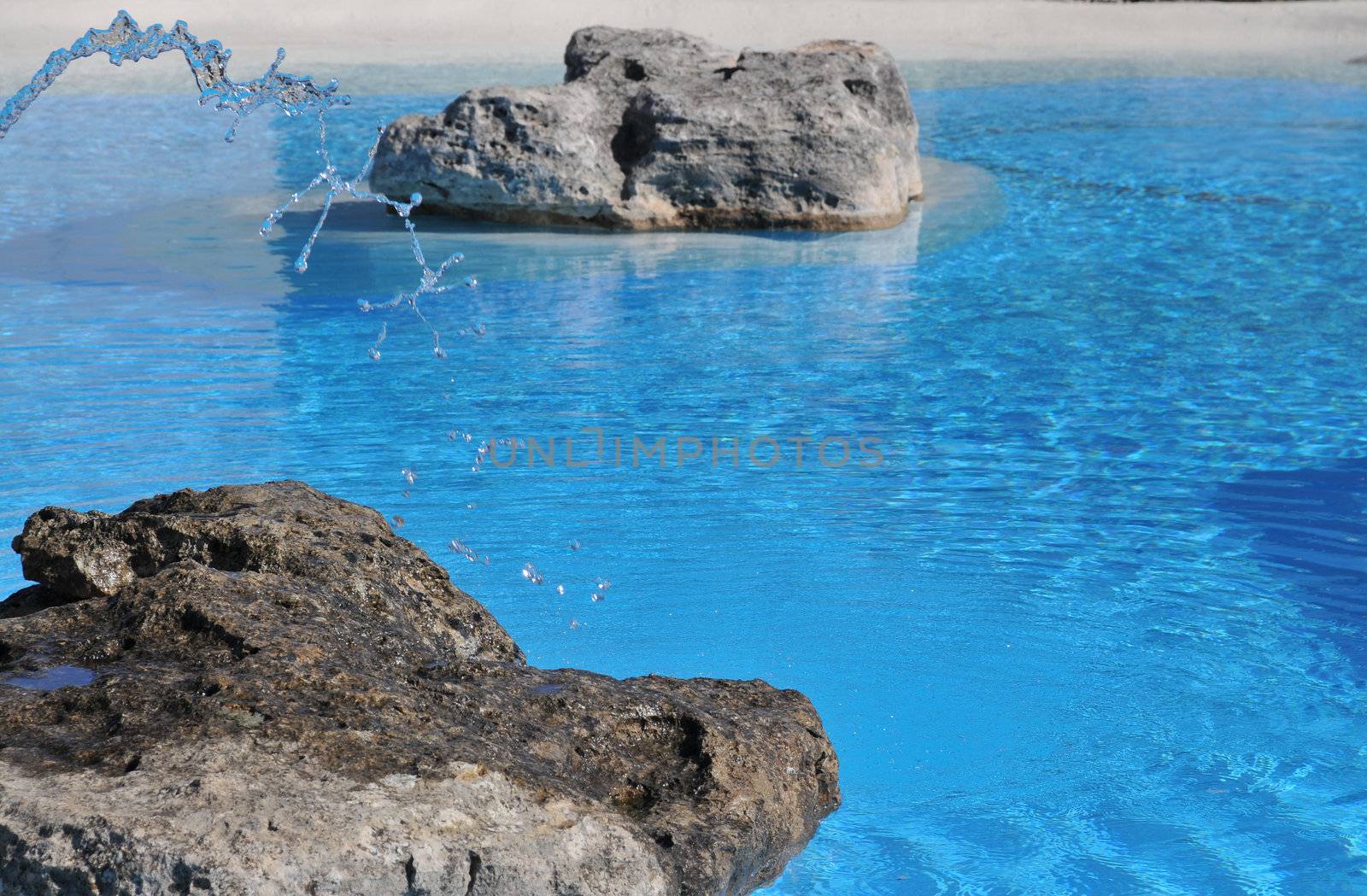 clear blue water of a man made lagoon