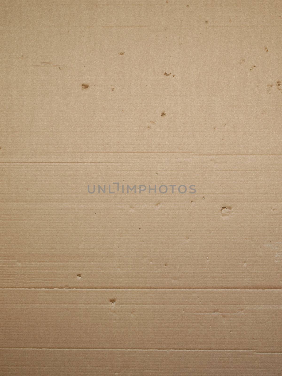 Brown corrugated cardboard packaging useful as a background