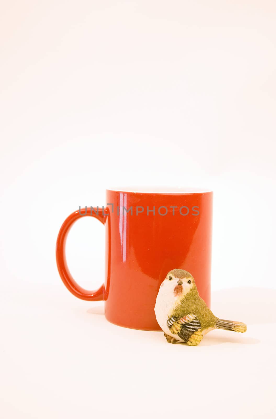 Red cup and figure of tick isolated on a white background