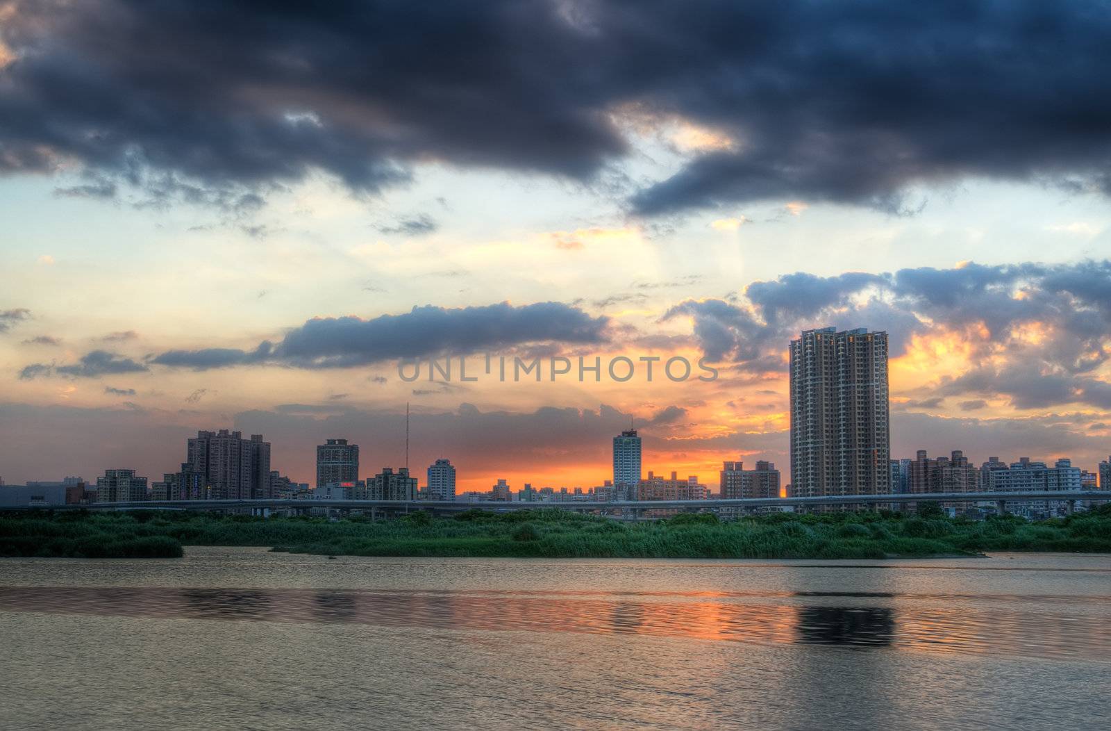 Here is city night scene with the river in Taiwan.