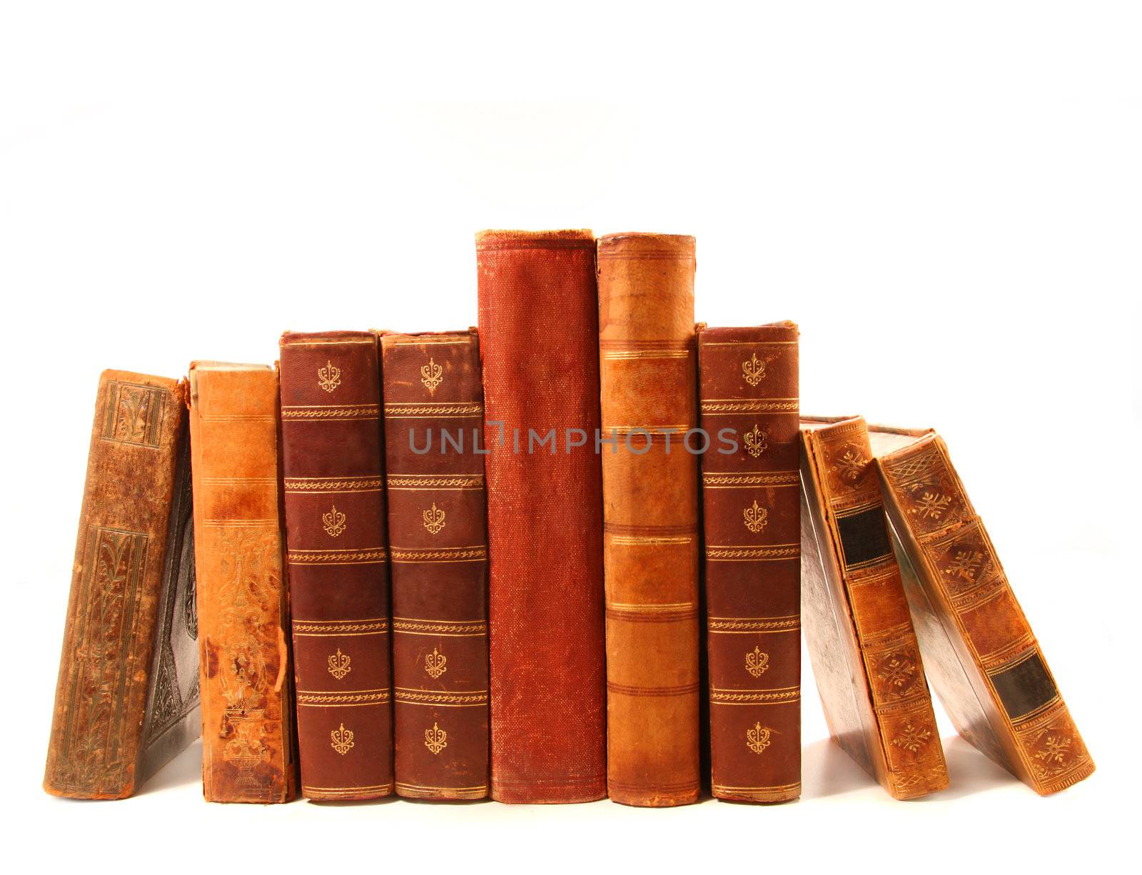 Old antique books against a white background