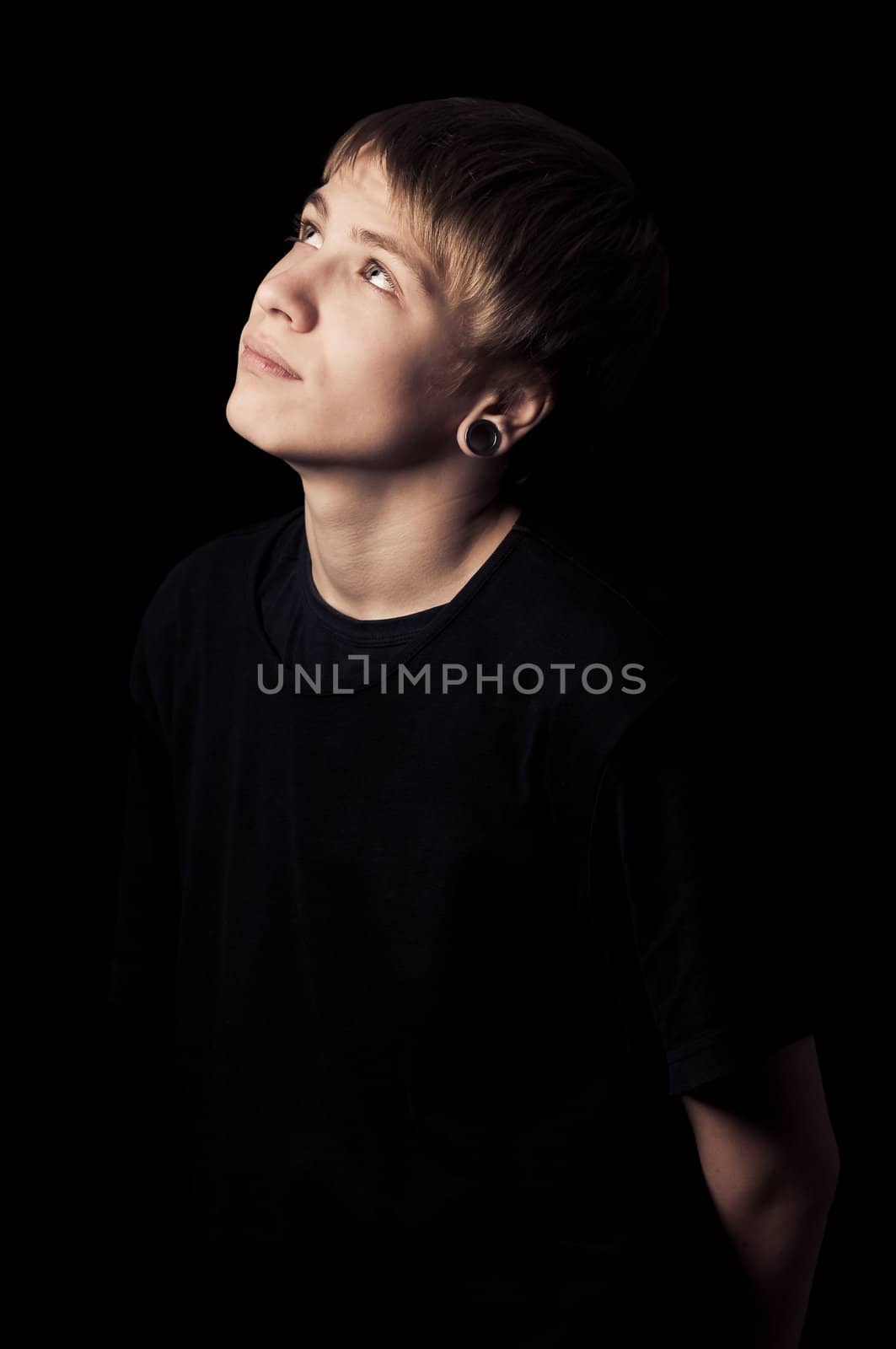 portrait of a teenager with toning on darken background