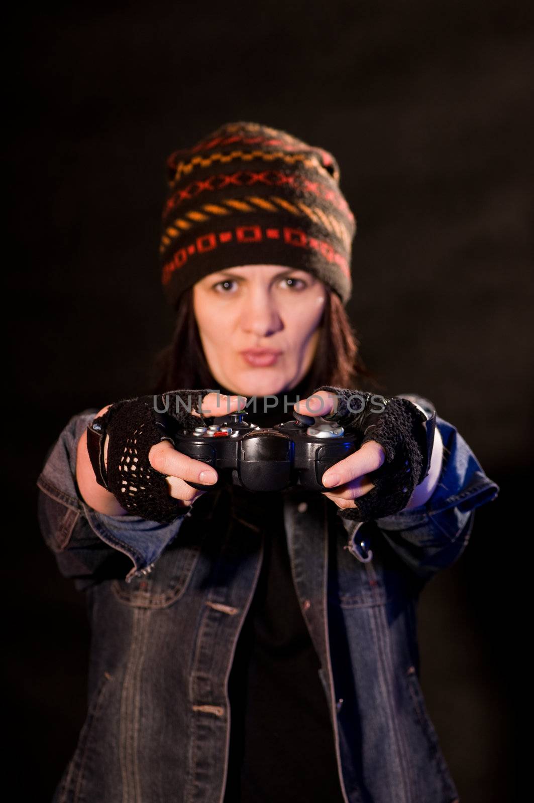 woman gamer with joystick  on dark background