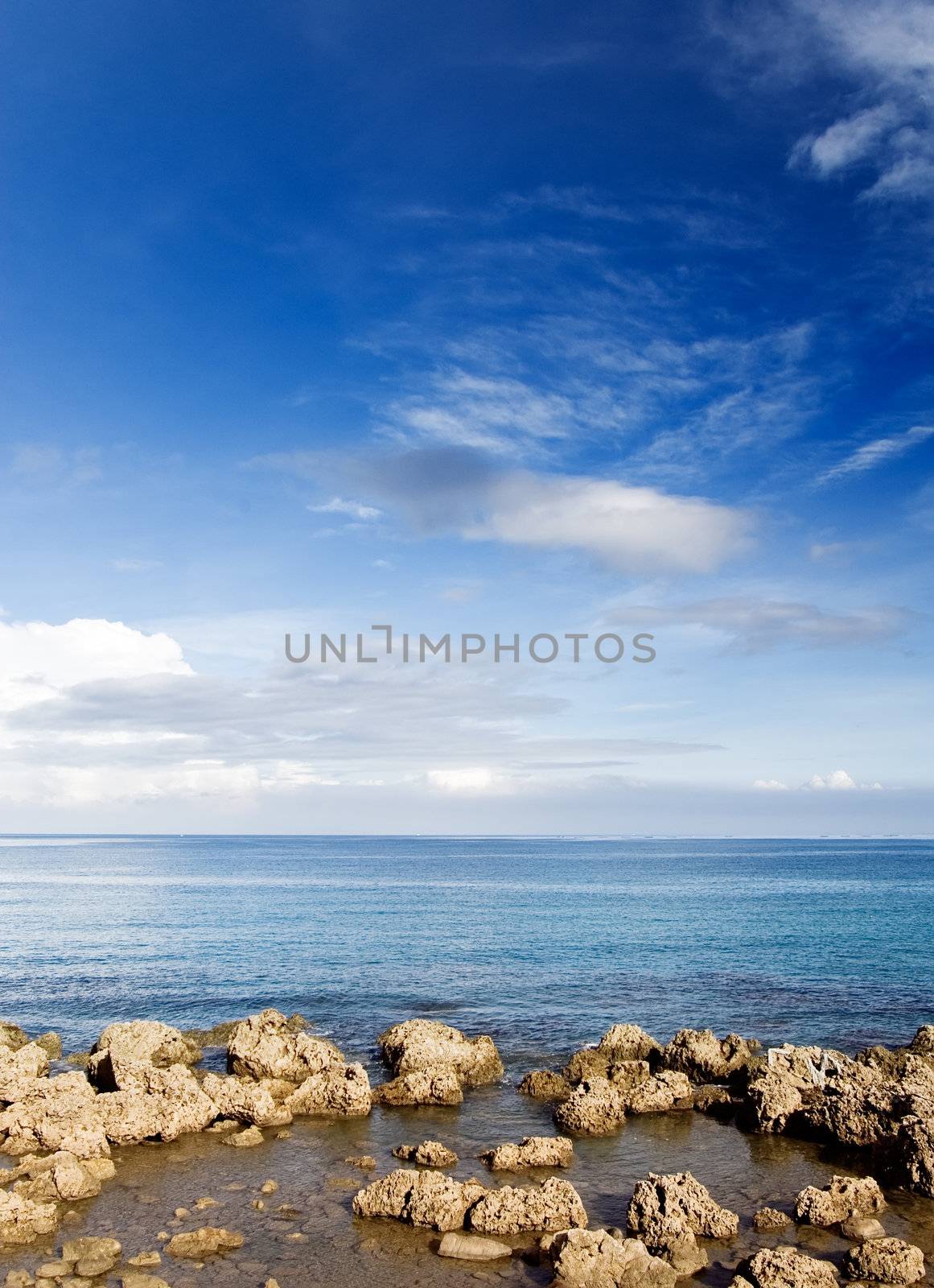 It is a beautiful coral reef rock coastline with blue sky in kenting of Taiwan.