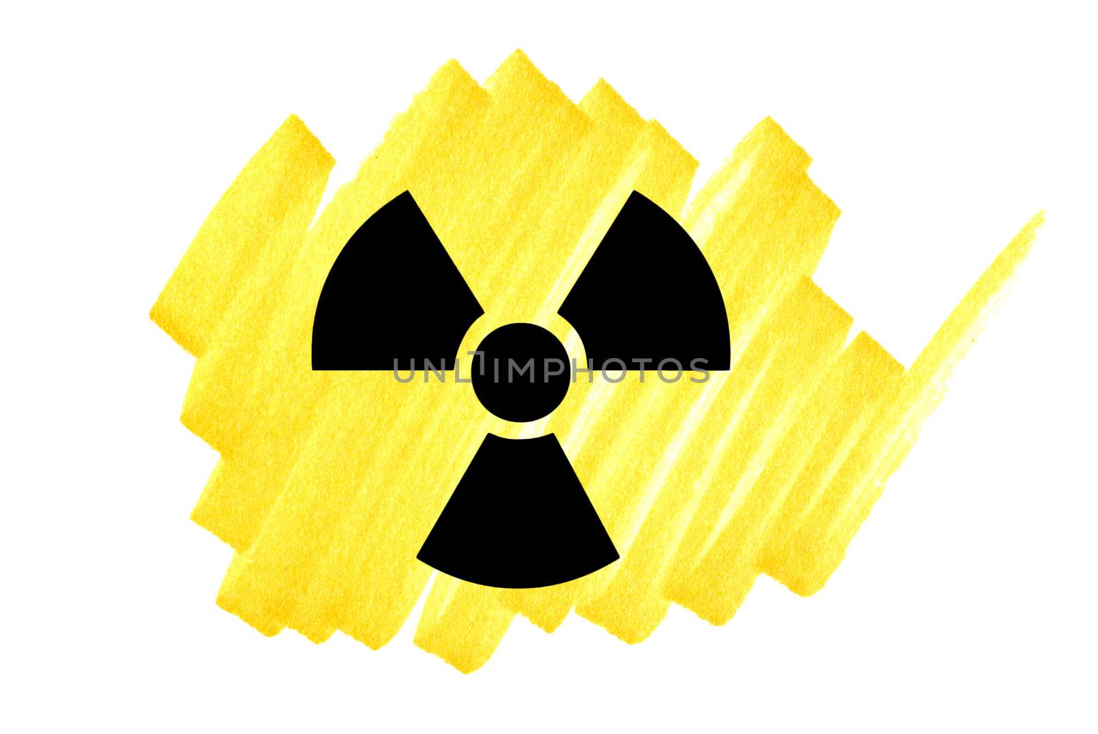 Radioactivity symbol in black on yellow ink marker scribble.