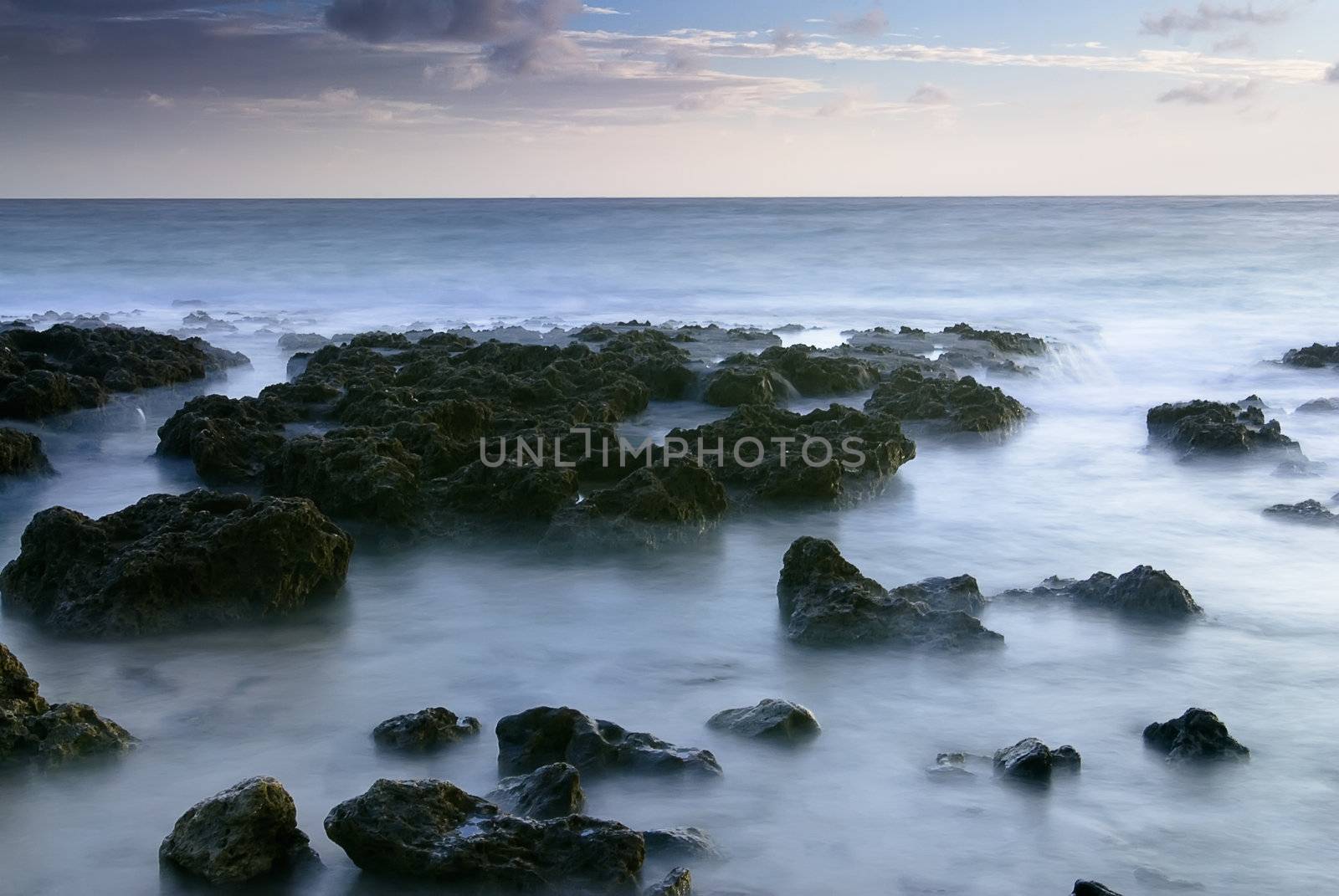 It is sunset of beautiful coral reef coastline.