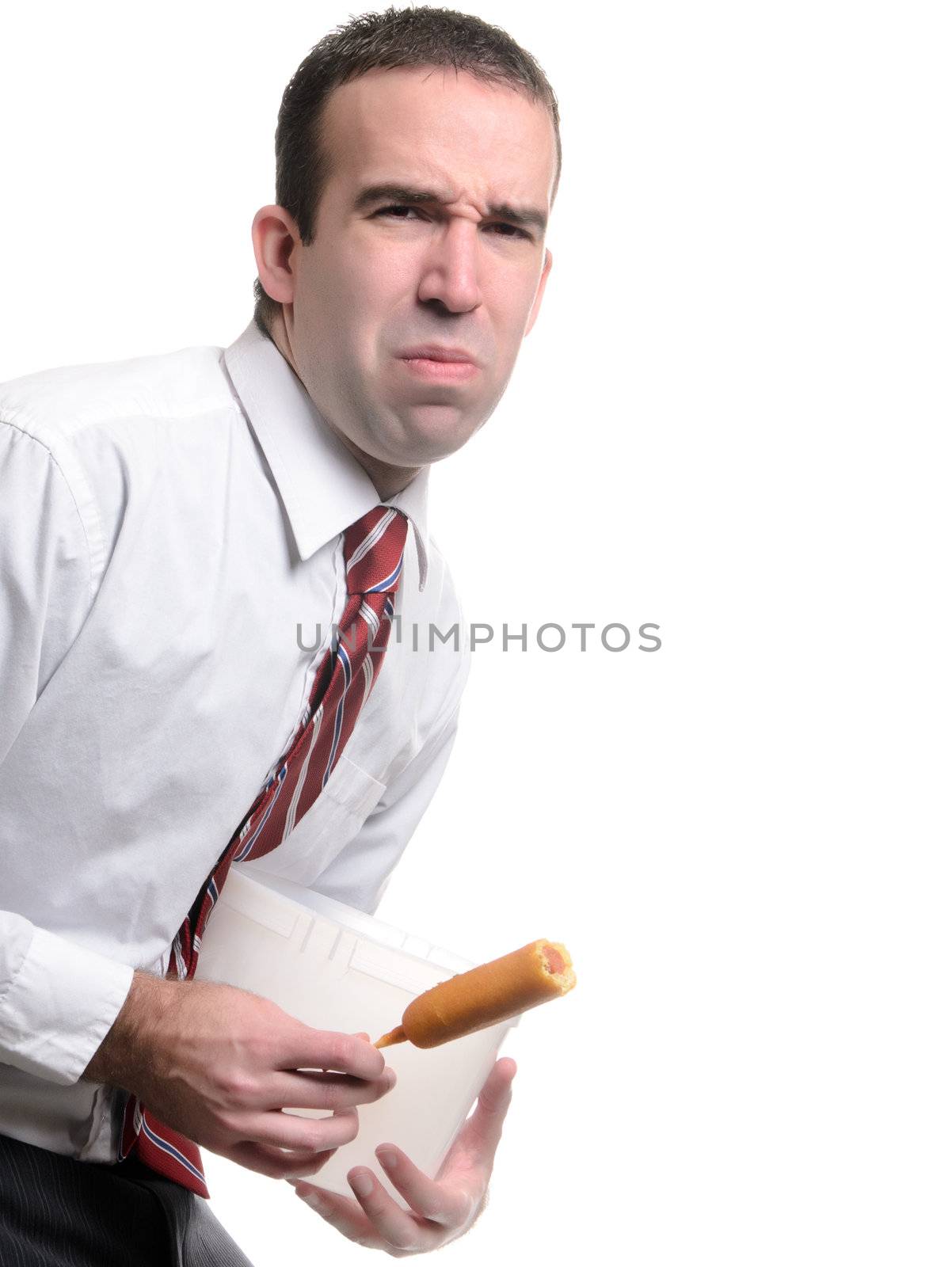 A young man with a stomach ache due to eating spoiled food, isolated against a white background.