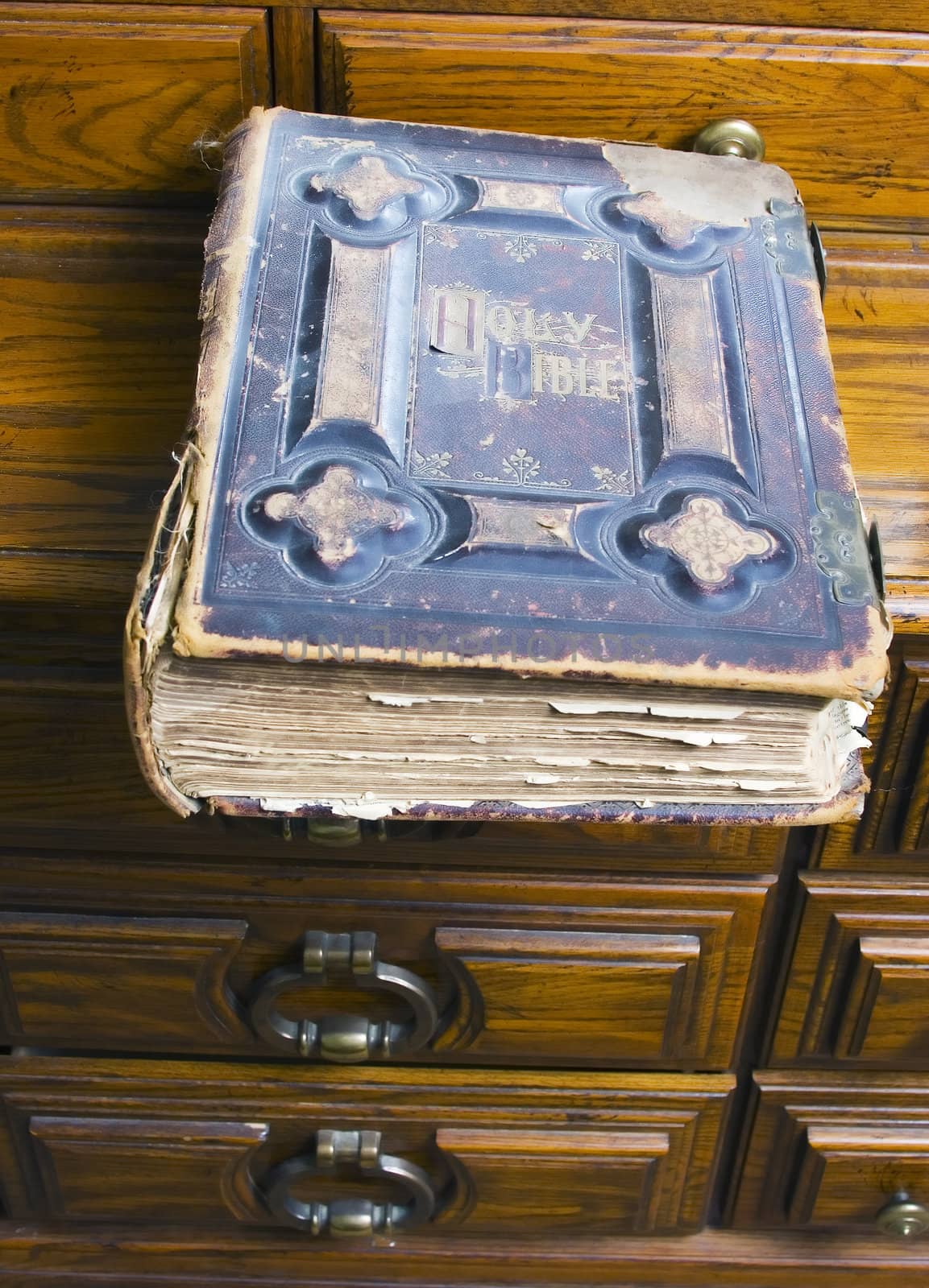 A 1825 preacher's bible sits on a dresser.