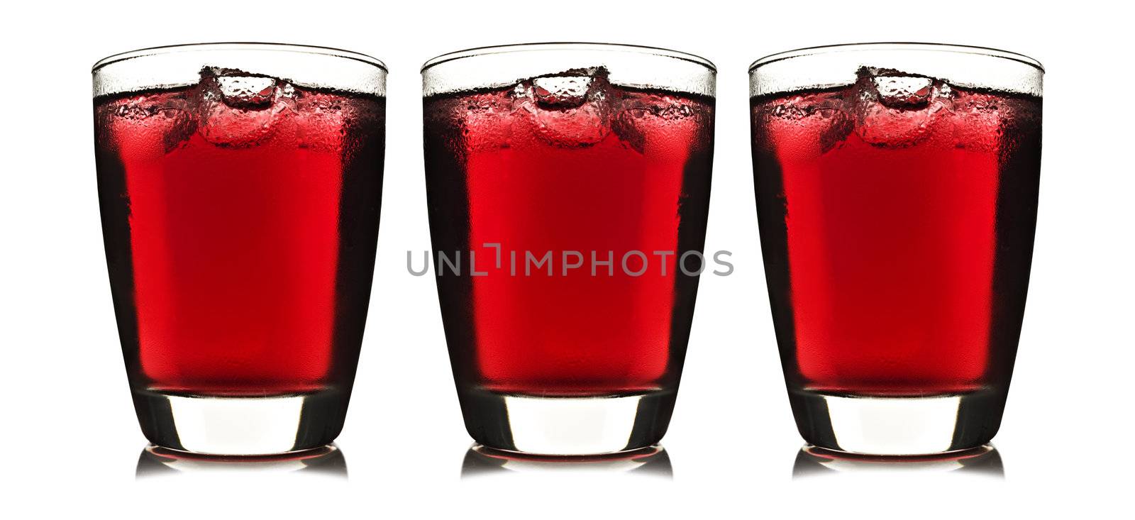 One glass of red fruit juice with ice by tish1