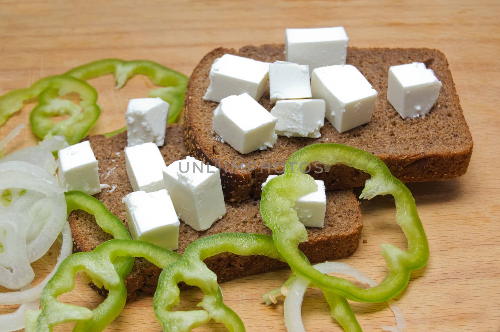 Feta cheese cubes with bread and pepper