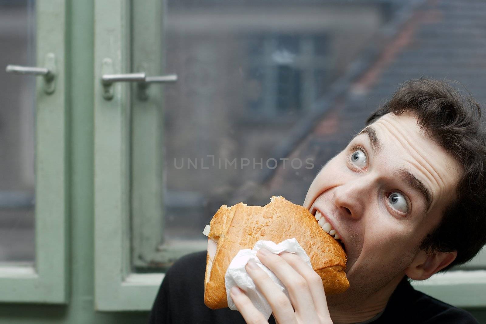 Man eating with silly expression