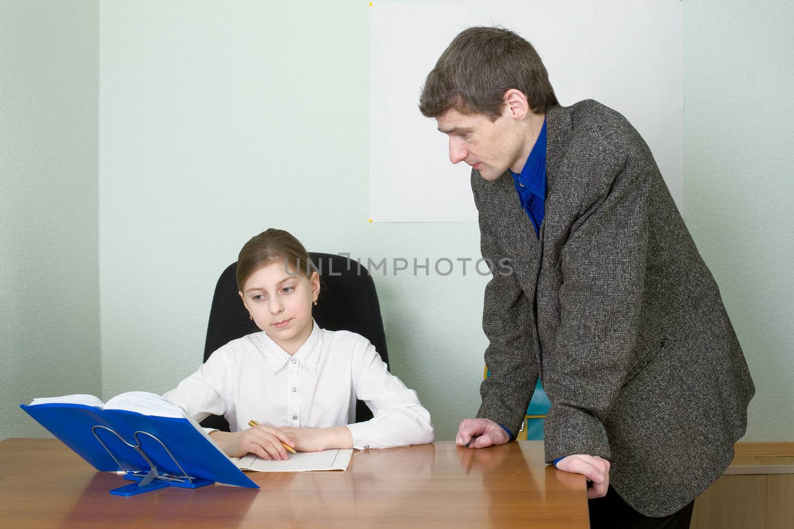 Tutor in a suit and its small schoolgirl