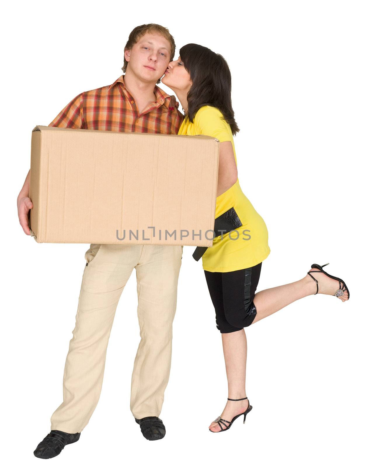 The girl kisses the guy holding a box