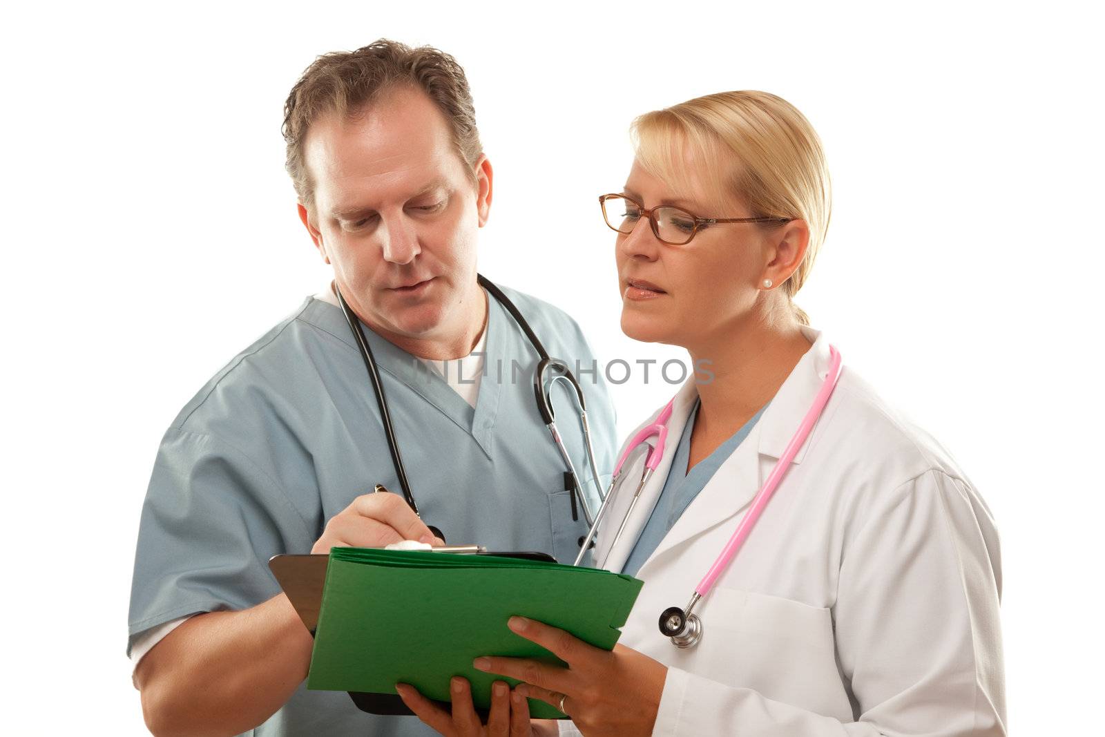 Male and Female Doctors Looking Over Files Isolated on a White Background.