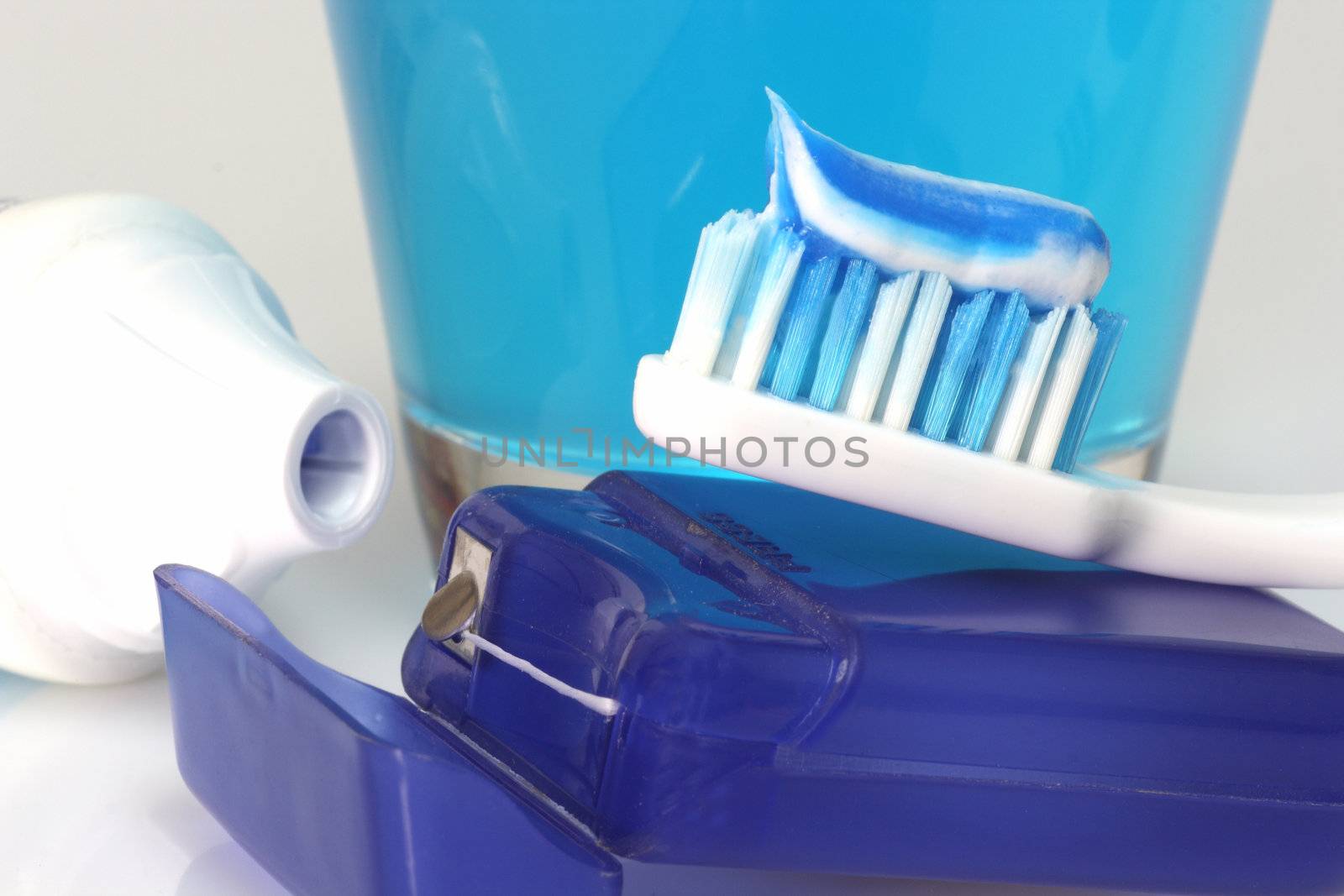 Dental care products on bright background