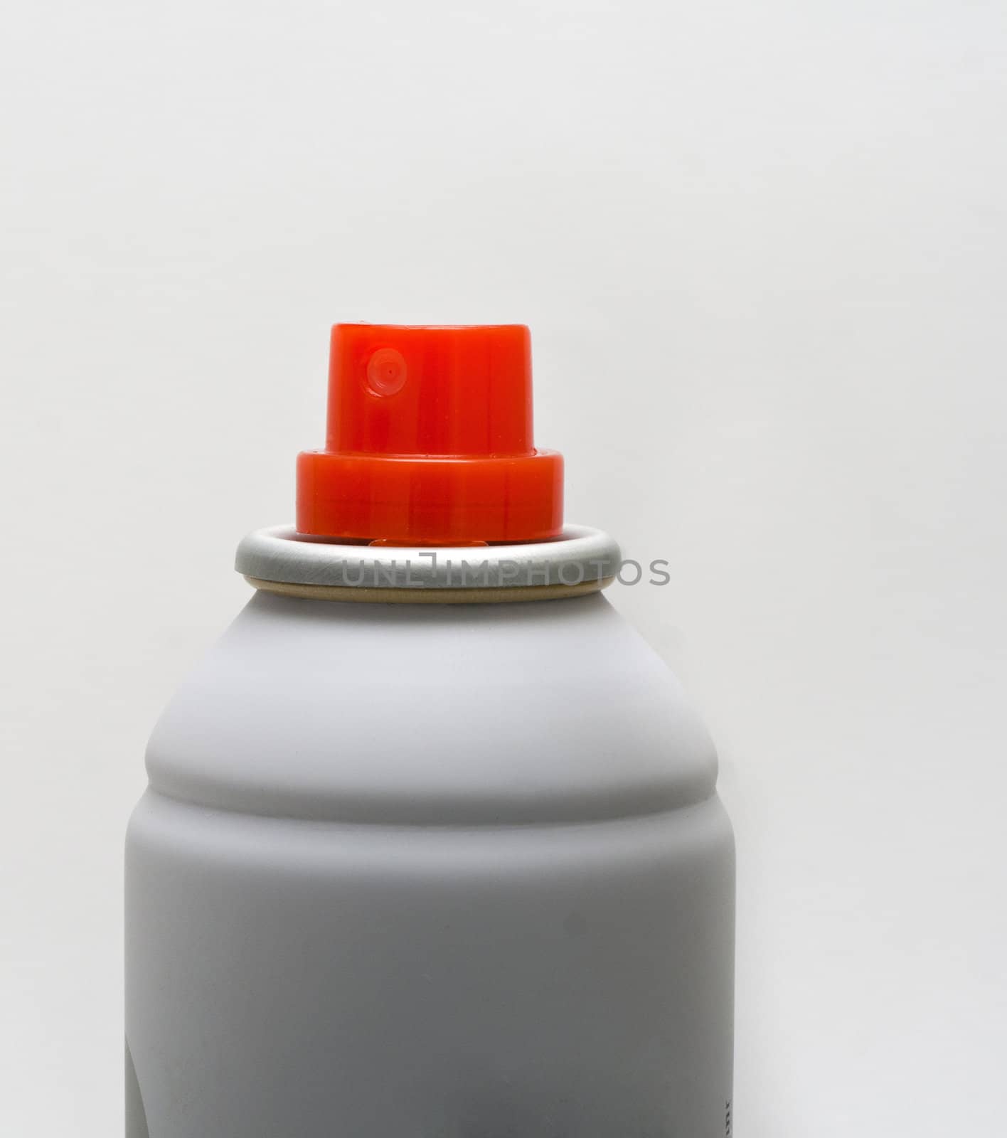 A white pump spray with an orange nozzel isolated on white