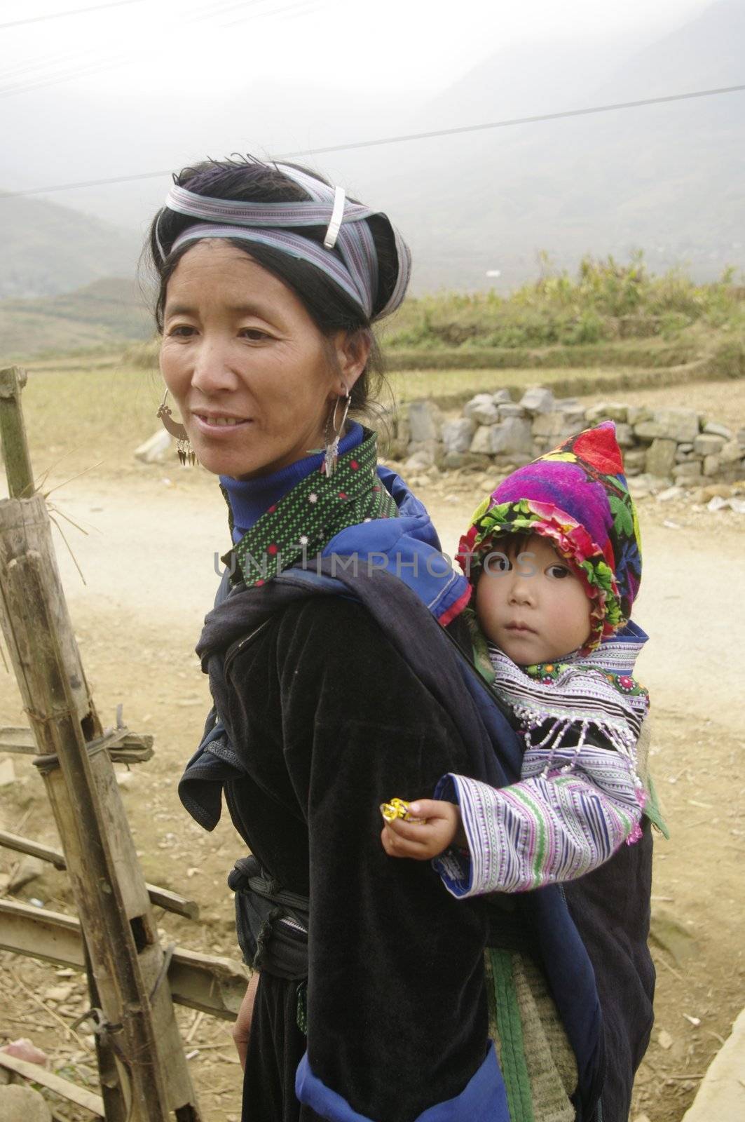 Black Hmong ethnic  woman and baby by Duroc