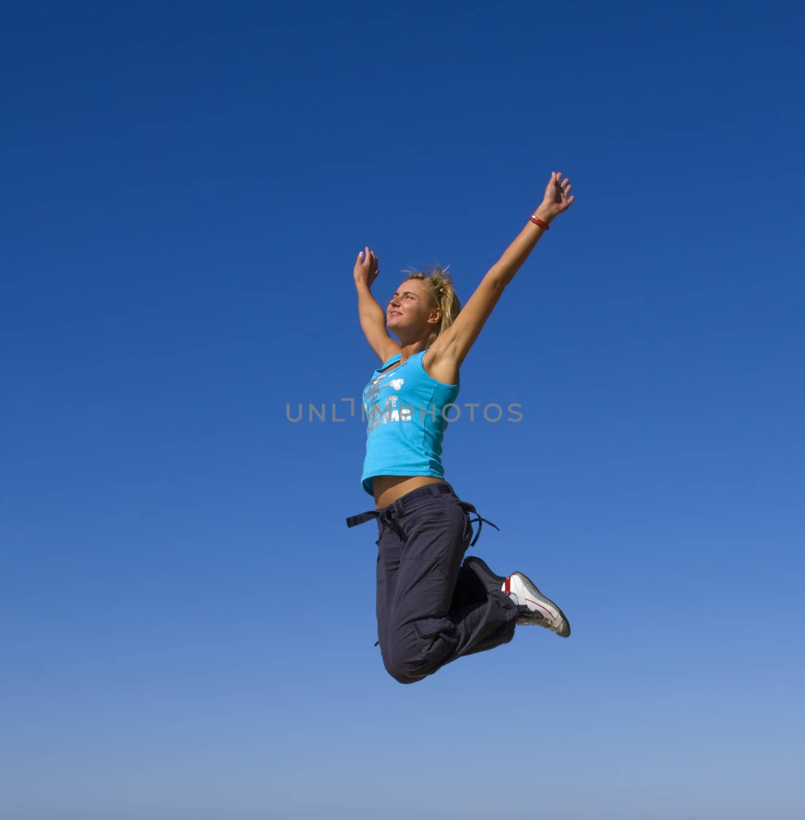 jumping girl blue sky high