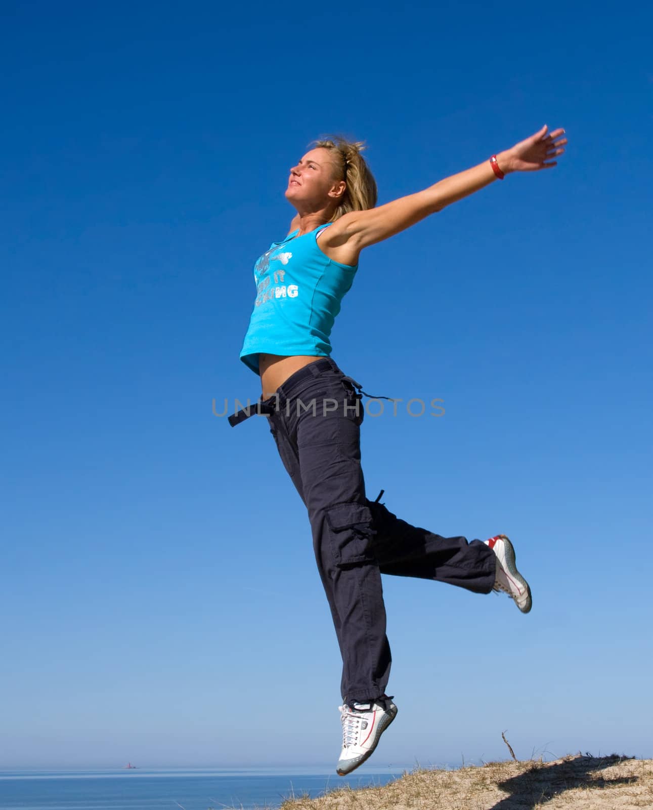 jumping girl blue sky high