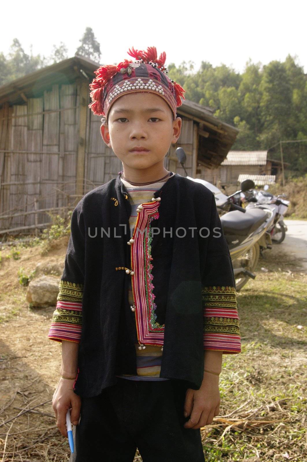 Boy of Red Dao ethnic group in their traditional dress. Region NorthVietnam