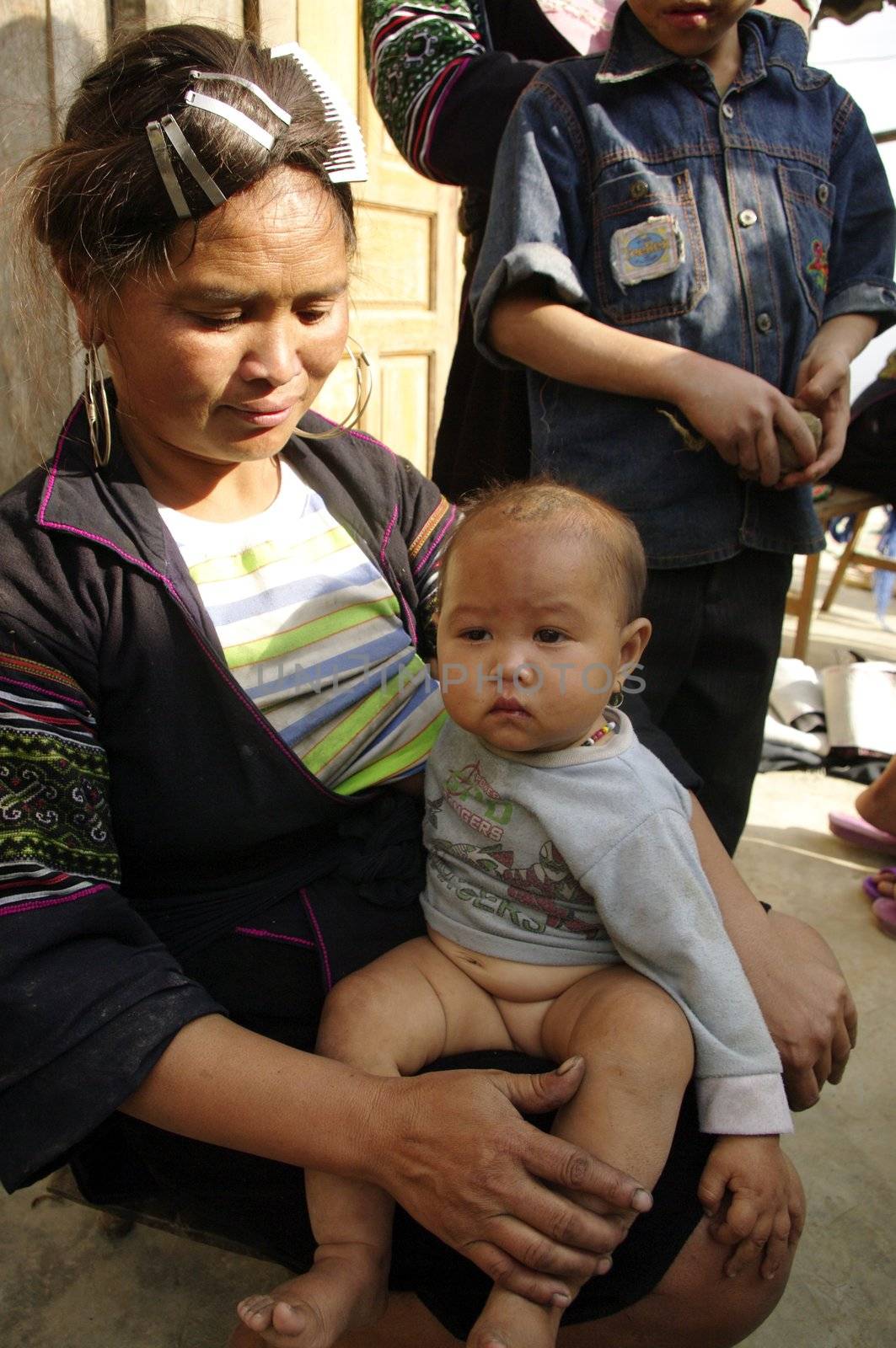 A black Hmong woman and baby by Duroc