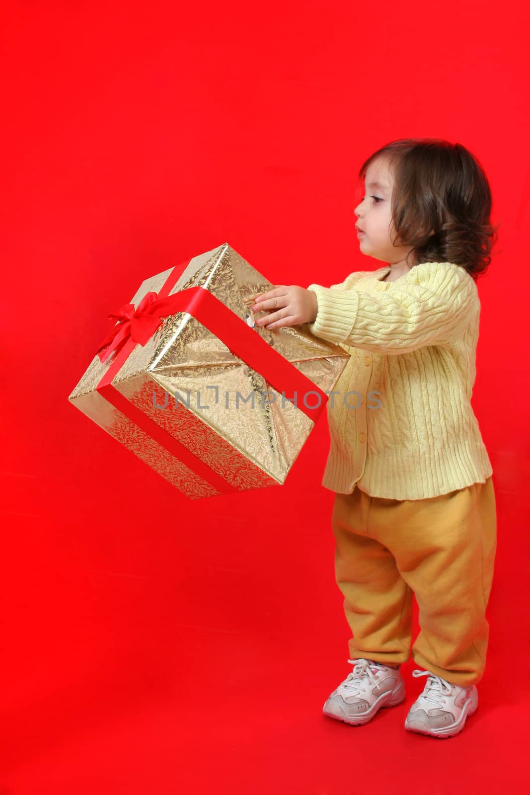 Cute little girl with a christmas gift