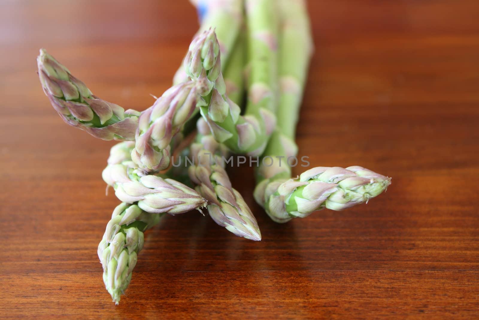 Bundle of asparagus on a wodden surface
