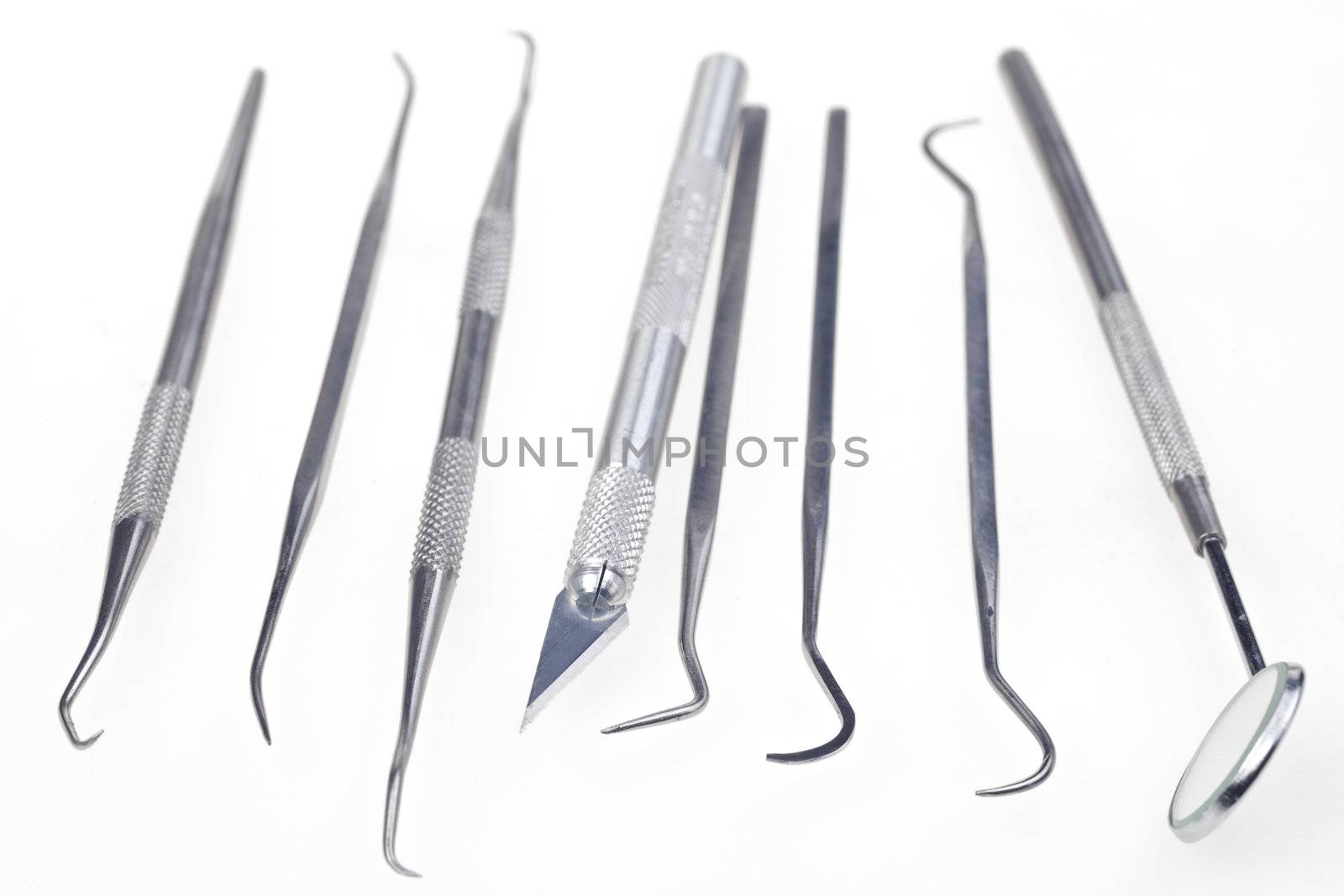 dentists tools isolated on a white background by bernjuer