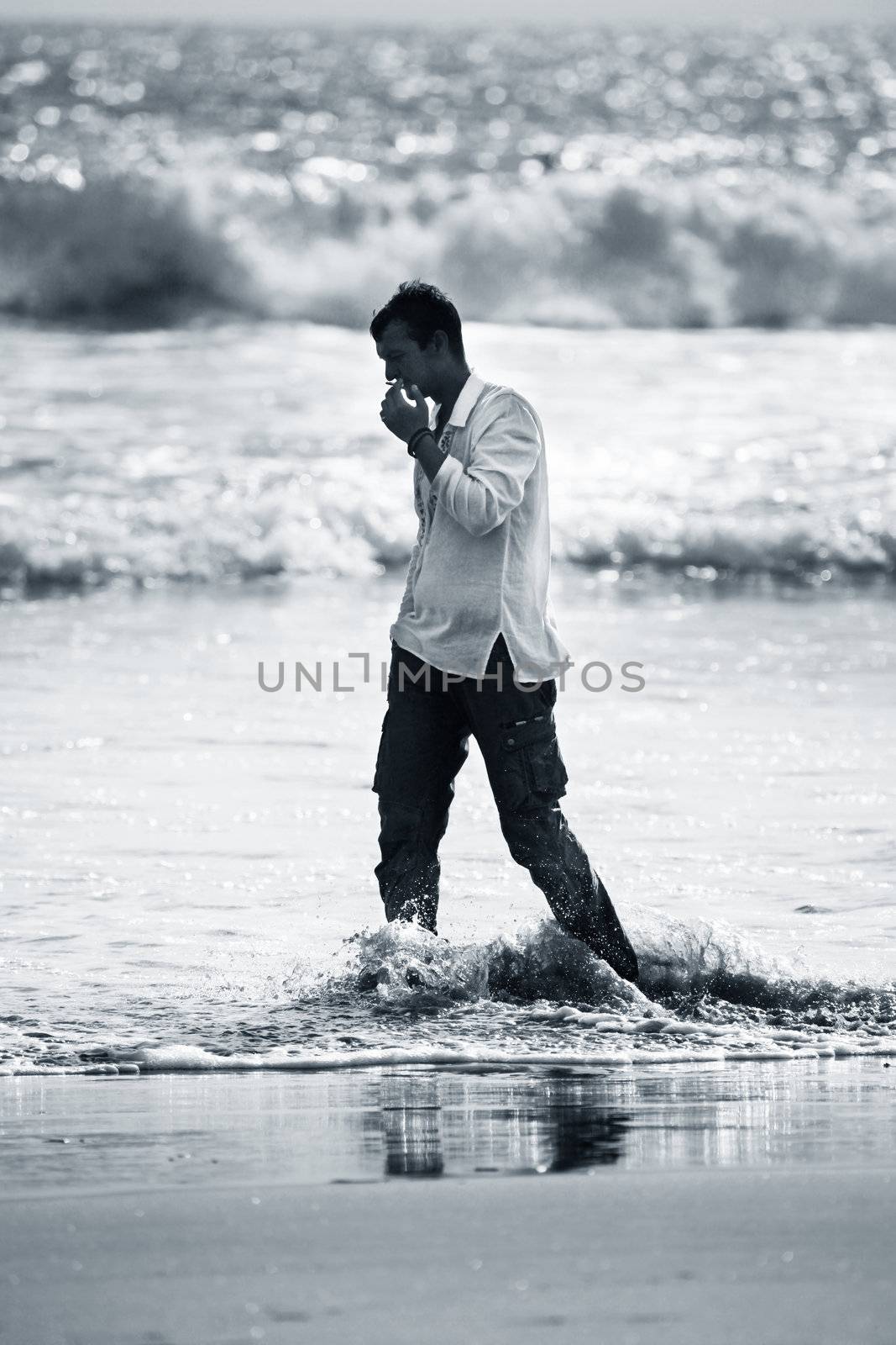 Lonely the man on a coast of ocean