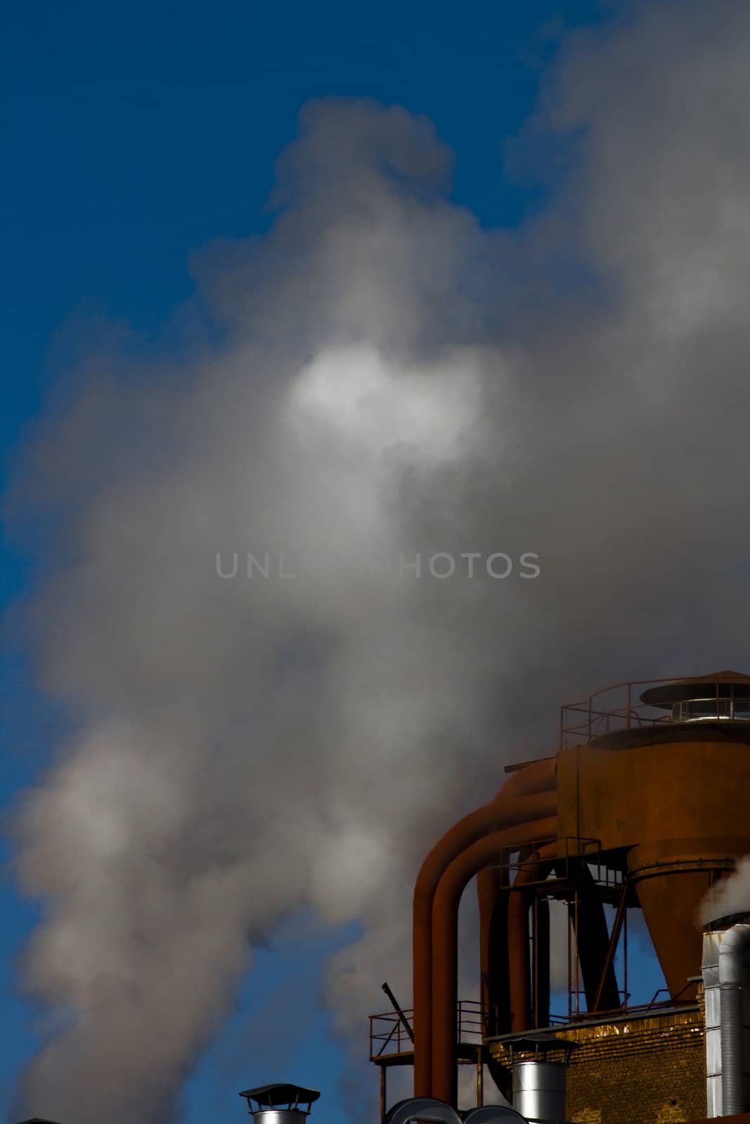 fabrike smoke with blue sky as background
