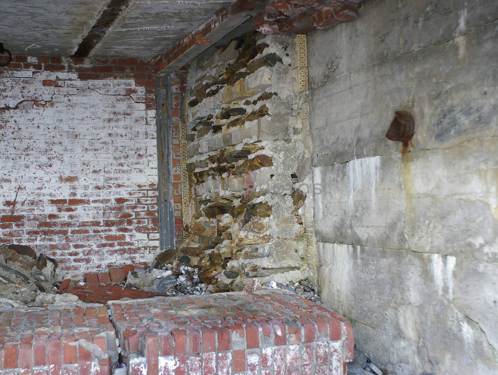 The inside walls of a building that are crumbling with age due abandment.