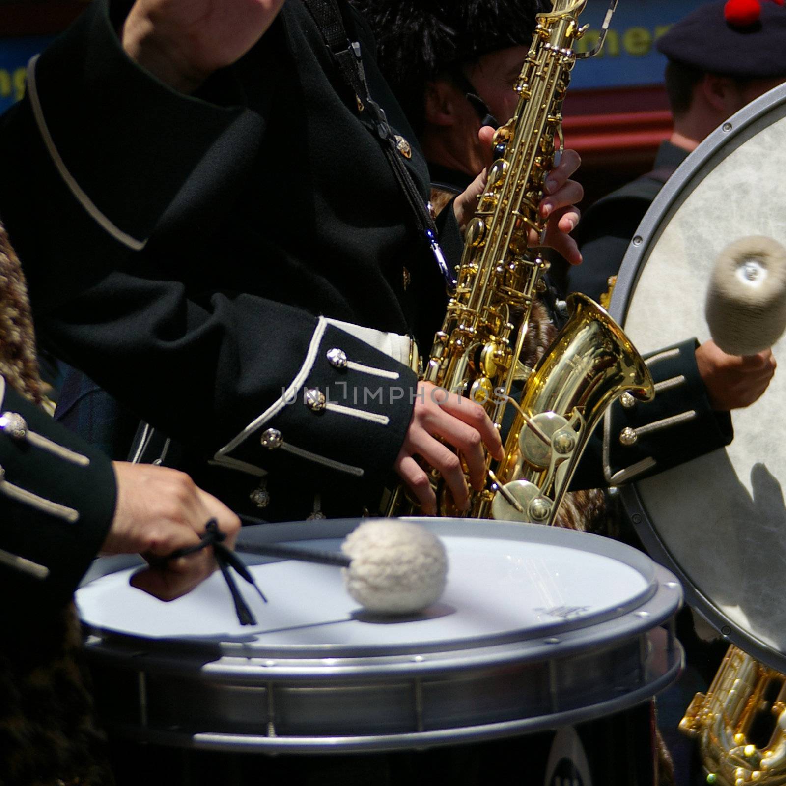 Saxophone and drums as part of a marching band.