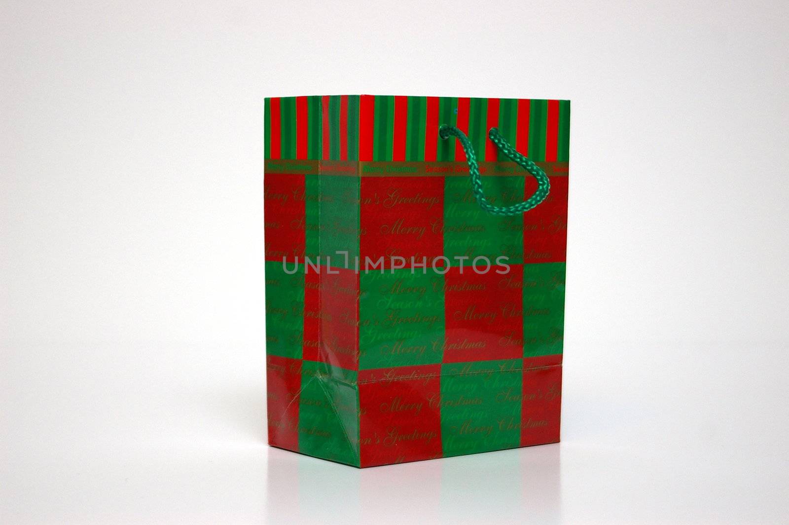 A red and green gift bag on a white background
