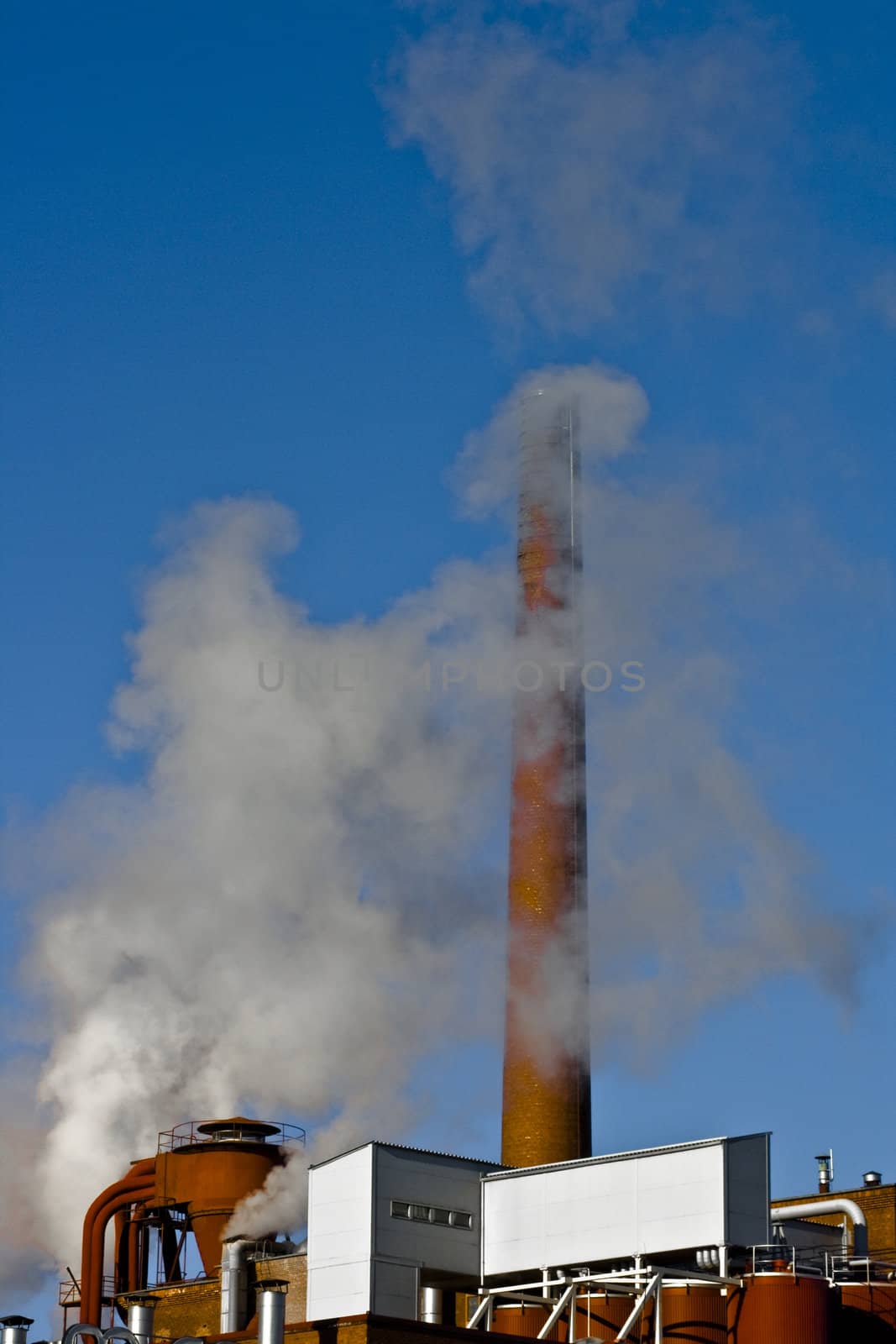 fabrike smoke with blue sky as background