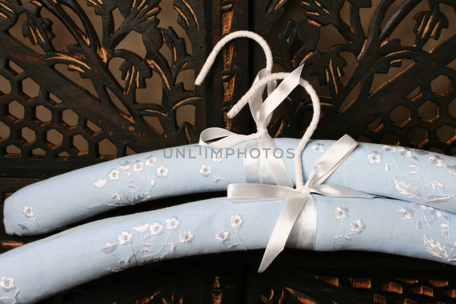 Blue Hangers on a rustic brown background