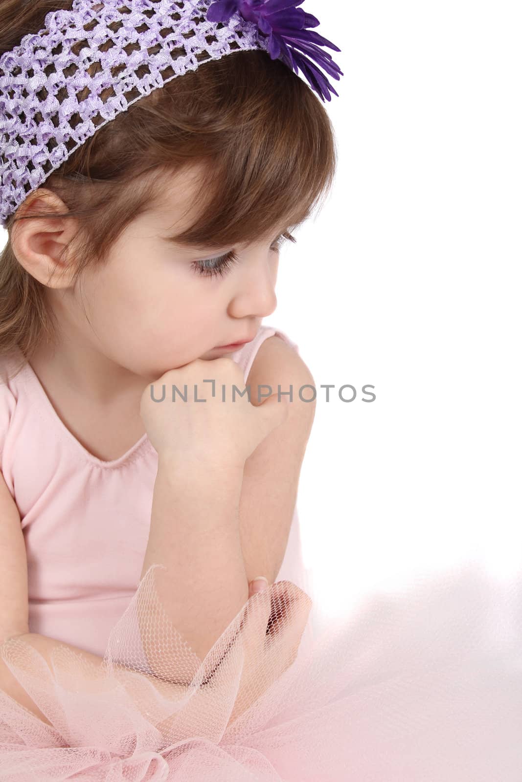 Serious brunette girl wearing a ballet tutu